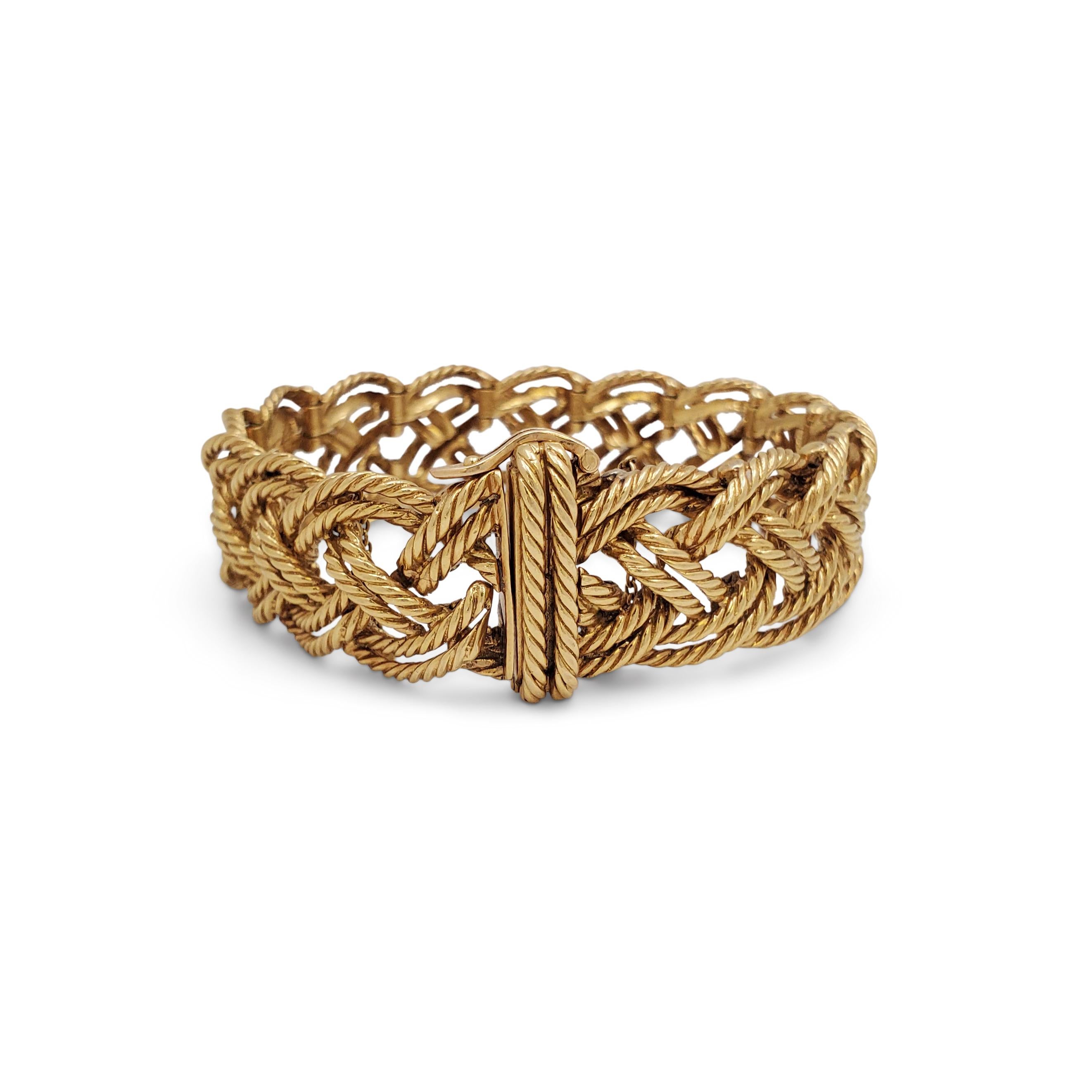 Authentic vintage Boucheron bracelet crafted in 18 karat gold.  Comprised of rope-textured links intricately woven into a braided pattern, the bracelet measures 6 1/2 inches in length.  Signed Boucheron Paris with French hallmarks.  Bracelet is not