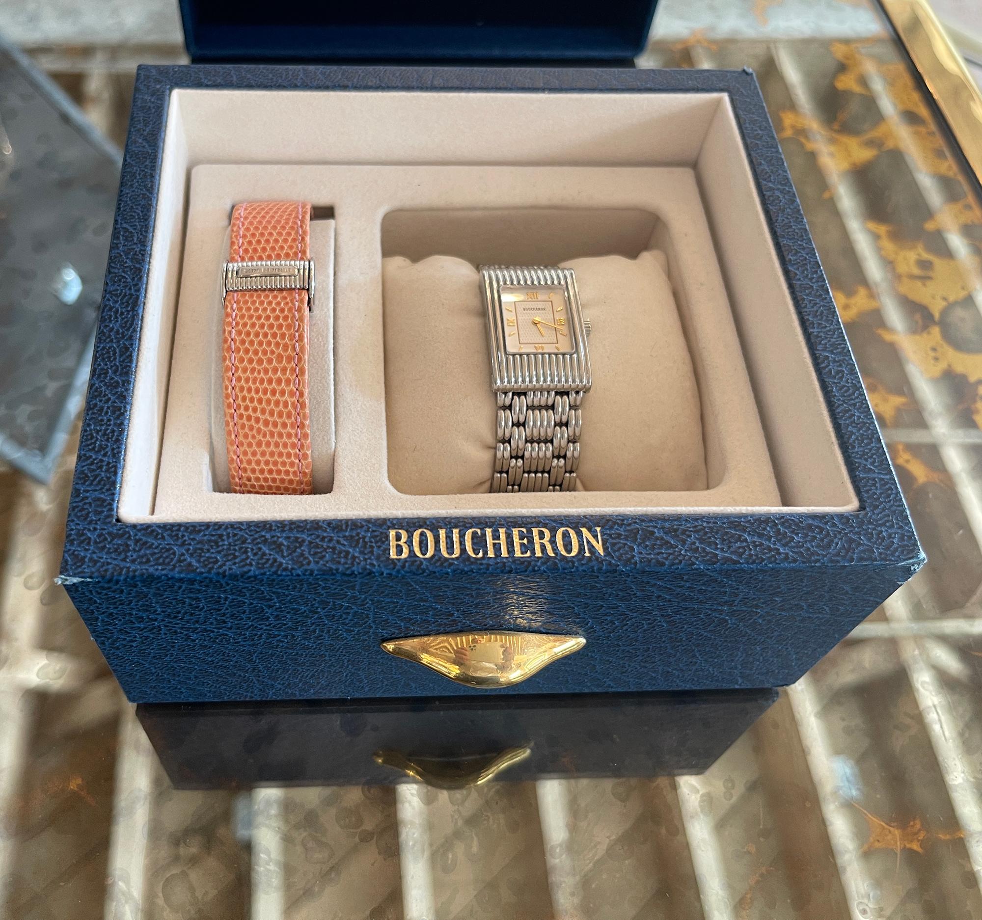 Wrist watch.
Designer  : BOUCHERON 
Model:  : Reflet 
Metal: Stainless Steel 
Movement:  Quartz
Measurements: 32mm x 22 mm (case) 
Functions: Hours, Minutes, Seconds, Date 
Comes with one extra Boucheron lezard strap (signed) + boxe and