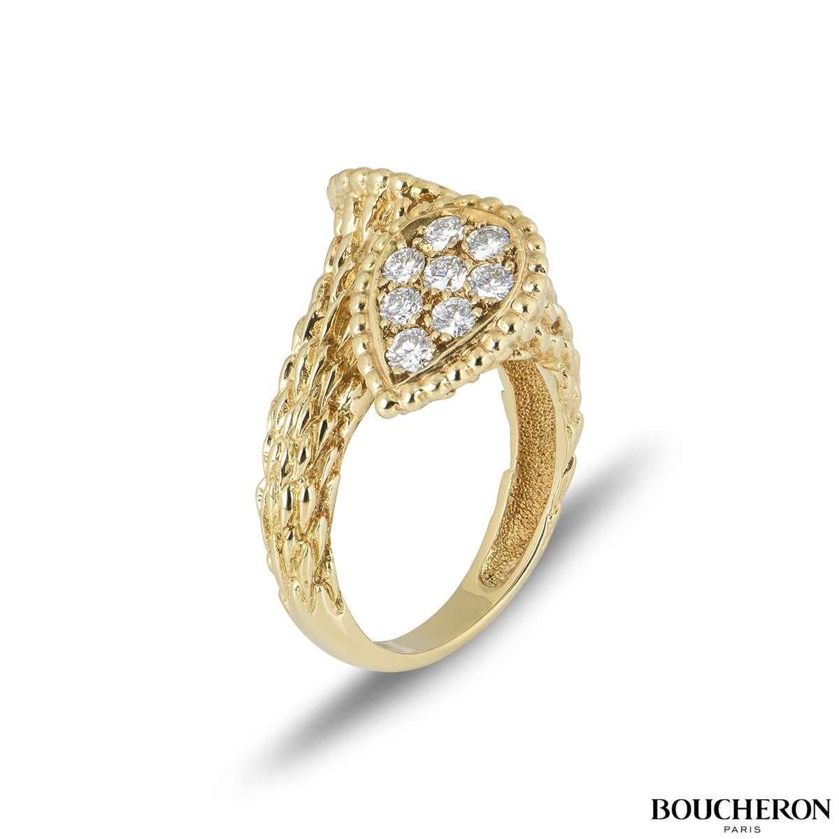 A fabulous 18k yellow gold Boucheron from the Serpent Bohème collection. The ring comprises of a textured ring leading up to two tear drop motifs with beading around the outer edge. There are 16 round brilliant cut diamonds with a total weight of