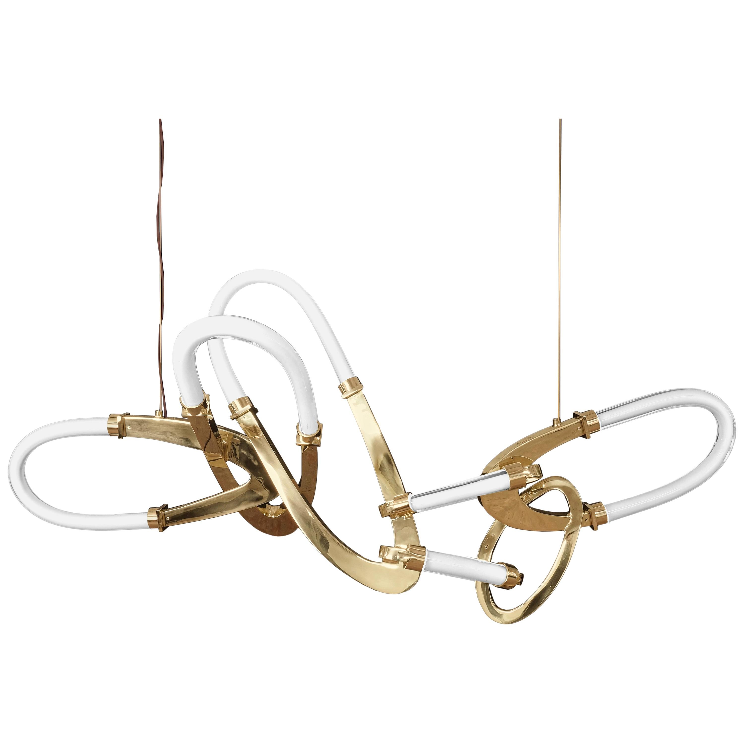 The Bouchon Chandelier by Barlas Baylar is one of the most innovative and spectacular designs in the Hudson Furniture line.  The Bouchon consists of an elegant chain of interlocked circular pendants made of solid bronze paired with contoured