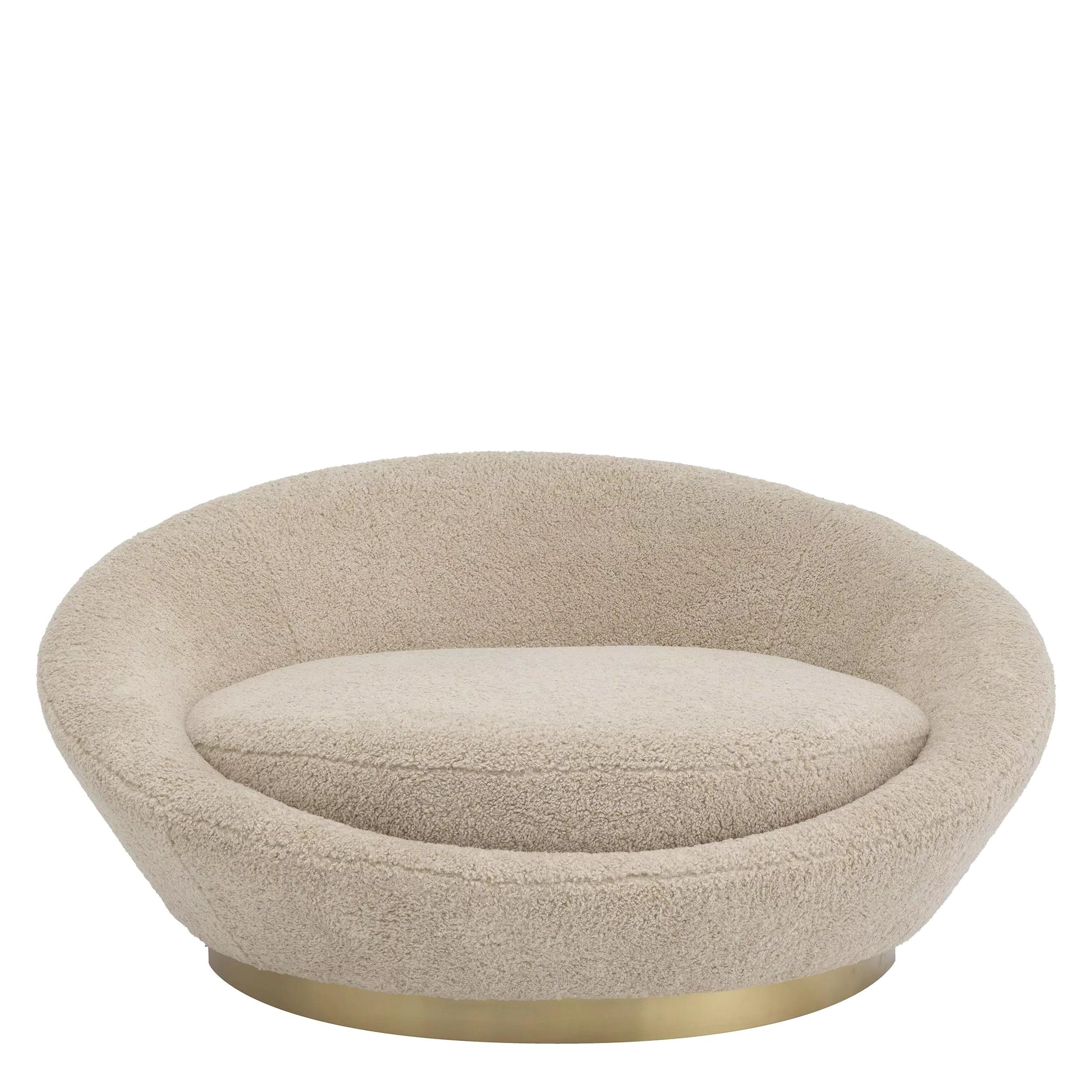 Welcoming and round shaped large armchair or sofa in bouclé fabric and brass finishes base.