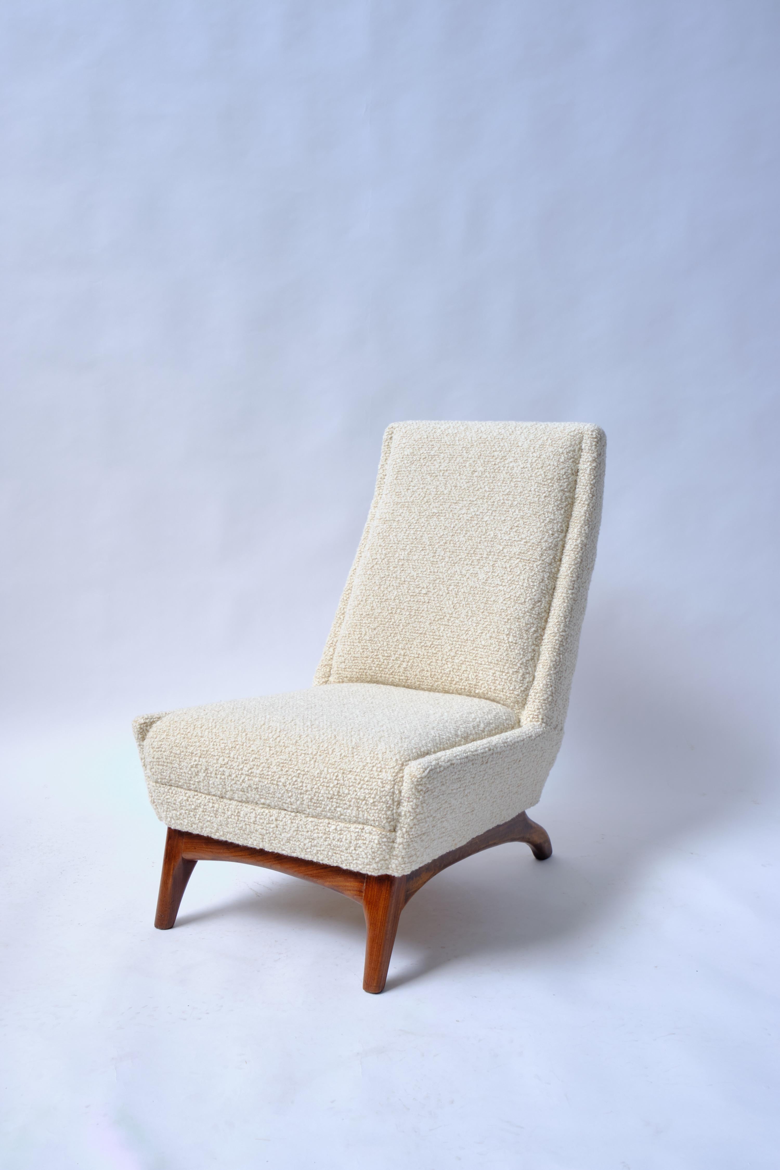 Midcentury Slipper chair.

Deco inspired Slipper Chair, with the ubiquitous low seat and tall back. Slipper chairs were originally produced in the 18th century for dressing the feet.These 20th Century versions are a much more paired down example,