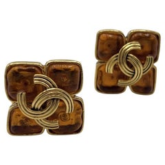 Boucles d'oreilles CHANEL CC Clip On métal doré 1994