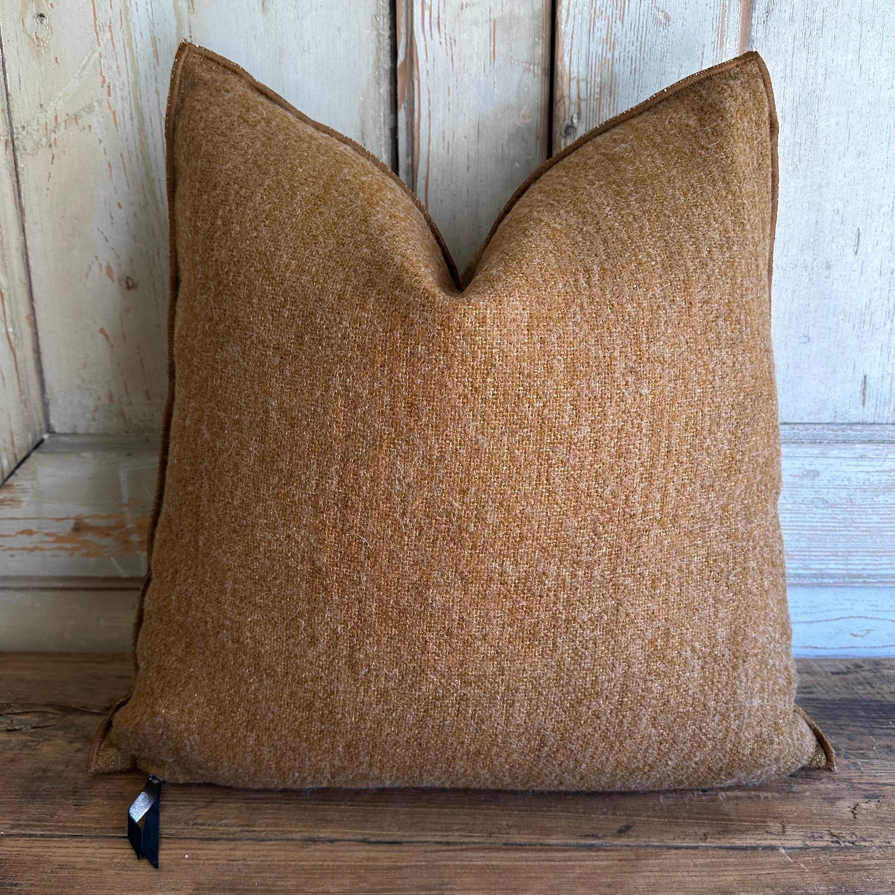 Custom wool blend accent pillow with down insert. 
Color:Havane which is a deep rust with warm brown tones, nubby boucle style pillow with a stitched edge, metal zipper closure. 
Size: 22”x22”.
Our pillows are constructed with vintage one of a