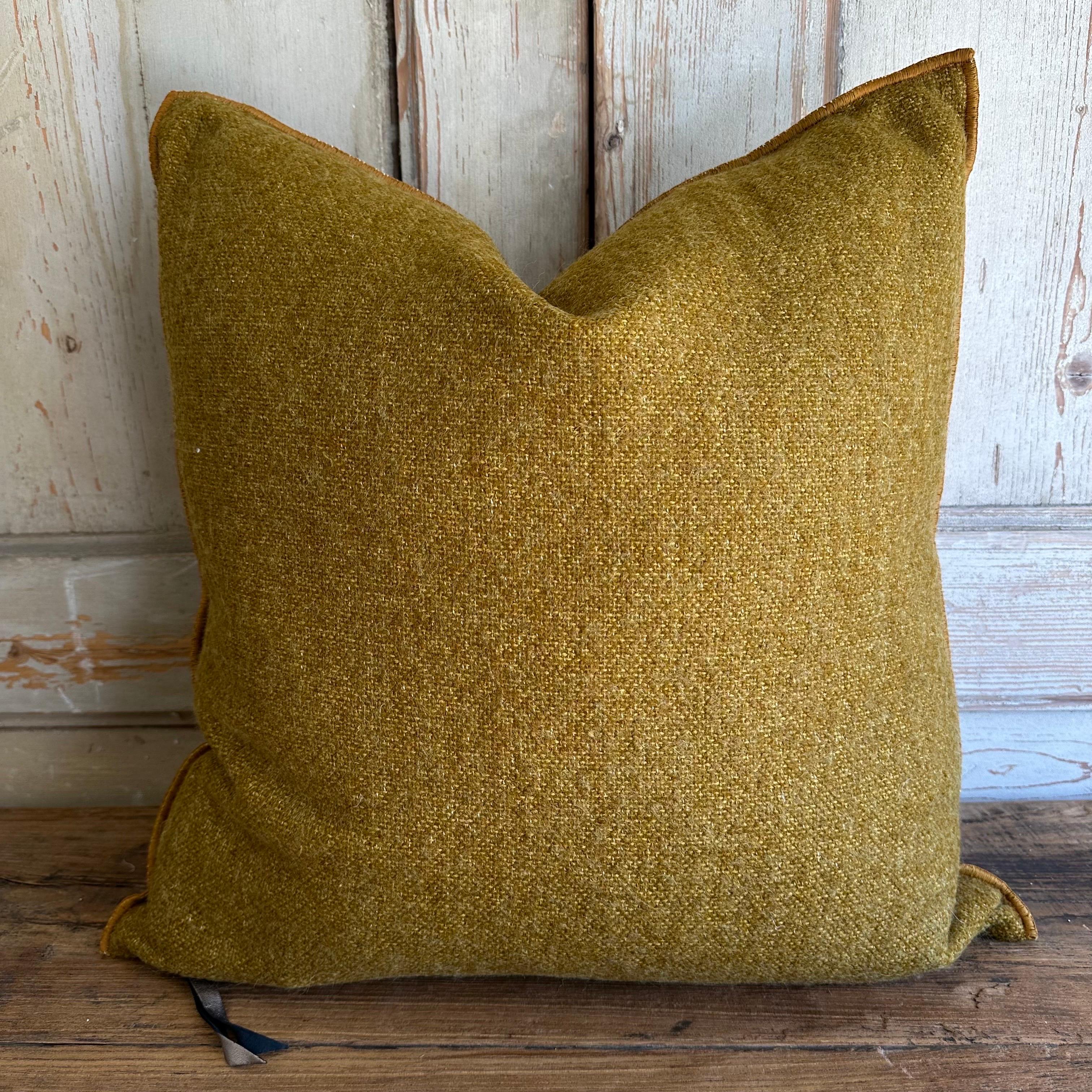 Custom wool blend accent pillow with down insert 
Color: Ocre which is a dijon french mustard colored nubby boucle style pillow with a stitched edge, metal zipper closure. 
Size: 22” x 22”
Our pillows are constructed with vintage one of a kind