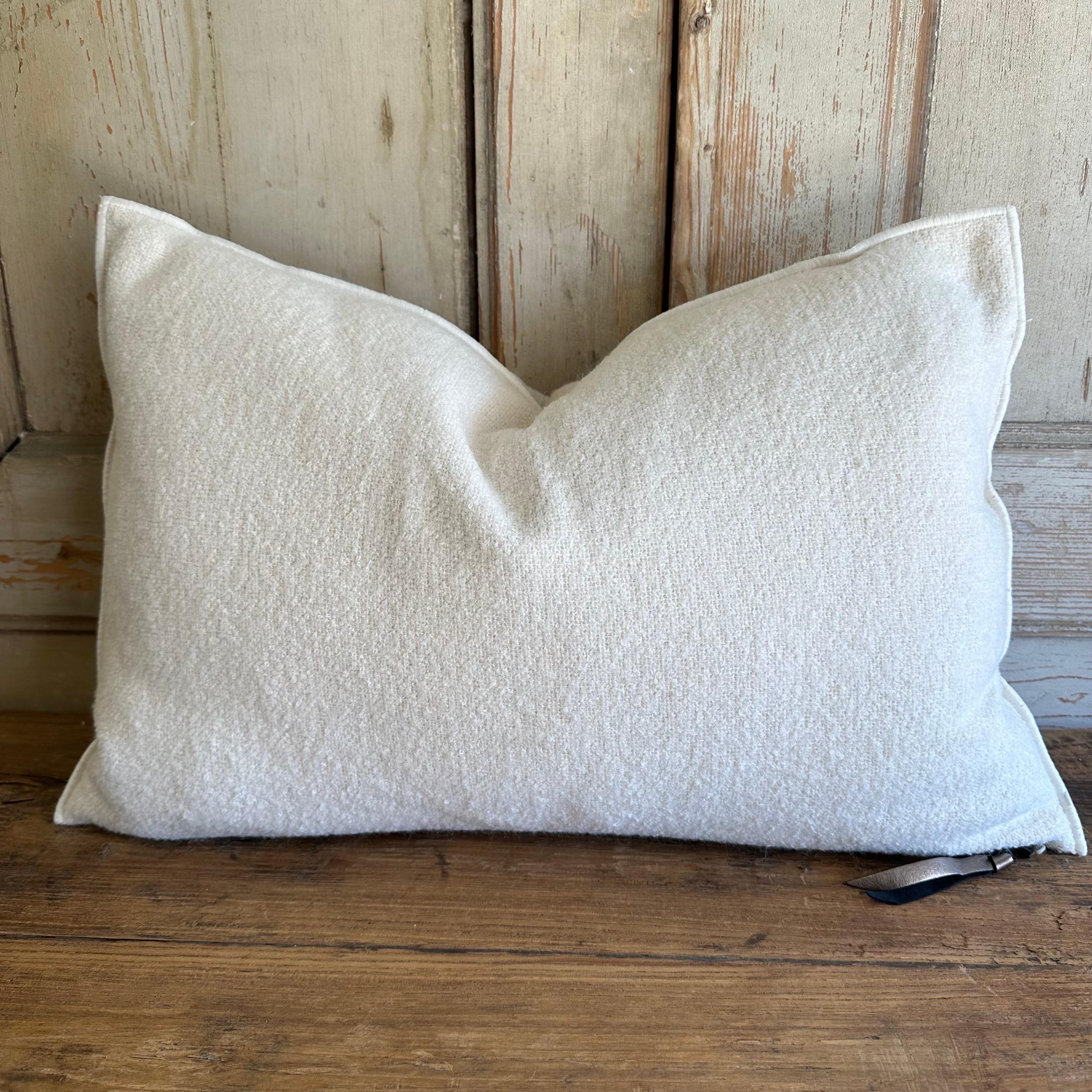 Custom wool blend accent pillow with down insert 
Color: Blance (a soft white or off white colored) nubby boucle style pillow with a stitched edge, metal zipper closure. 
Size: 14”x23”
Our pillows are constructed with vintage one of a kind
