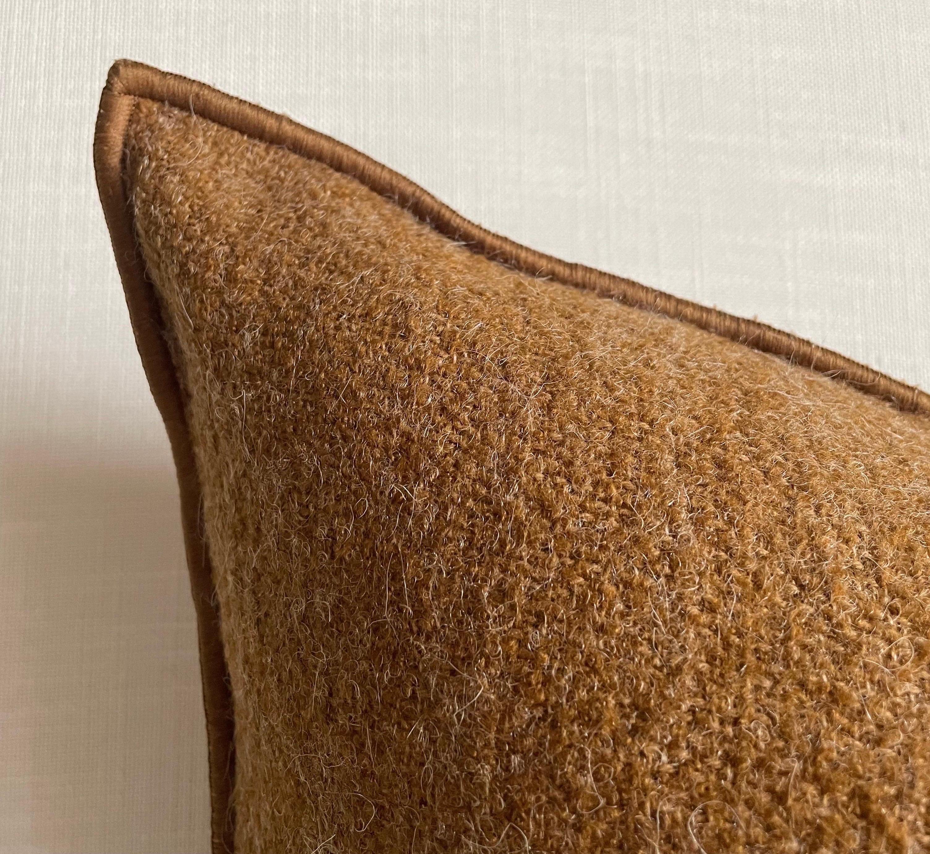 Custom wool blend accent pillow with down insert 
Color: Havane A deep rust colored nubby boucle style pillow with a stitched edge, metal zipper closure. 
Our pillows are constructed with vintage one of a kind textiles from around the globe.