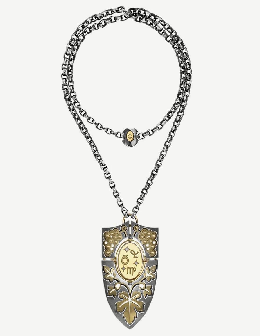 Diamonds Onyx Bouclier Pendant Terre in 18k white gold by Elie Top. Terre Shield Necklace in 18K yellow gold and patinated silver. Rotating medallion. On one side are engraved the zodiac signs of the EARTH (Virgo, Capricorn, Taurus). On the other, a