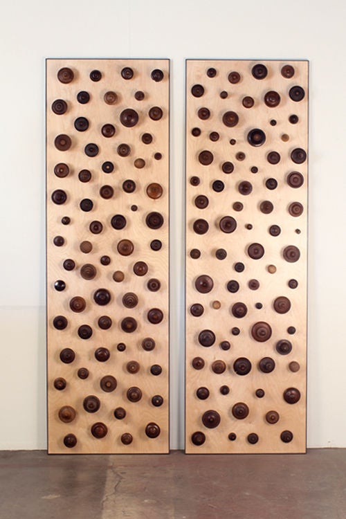 'Boucliers', a pair of decorative turned wood panels by Eric Thévenot. Unique piece, signed and dated 2012. Patinated steel edges.