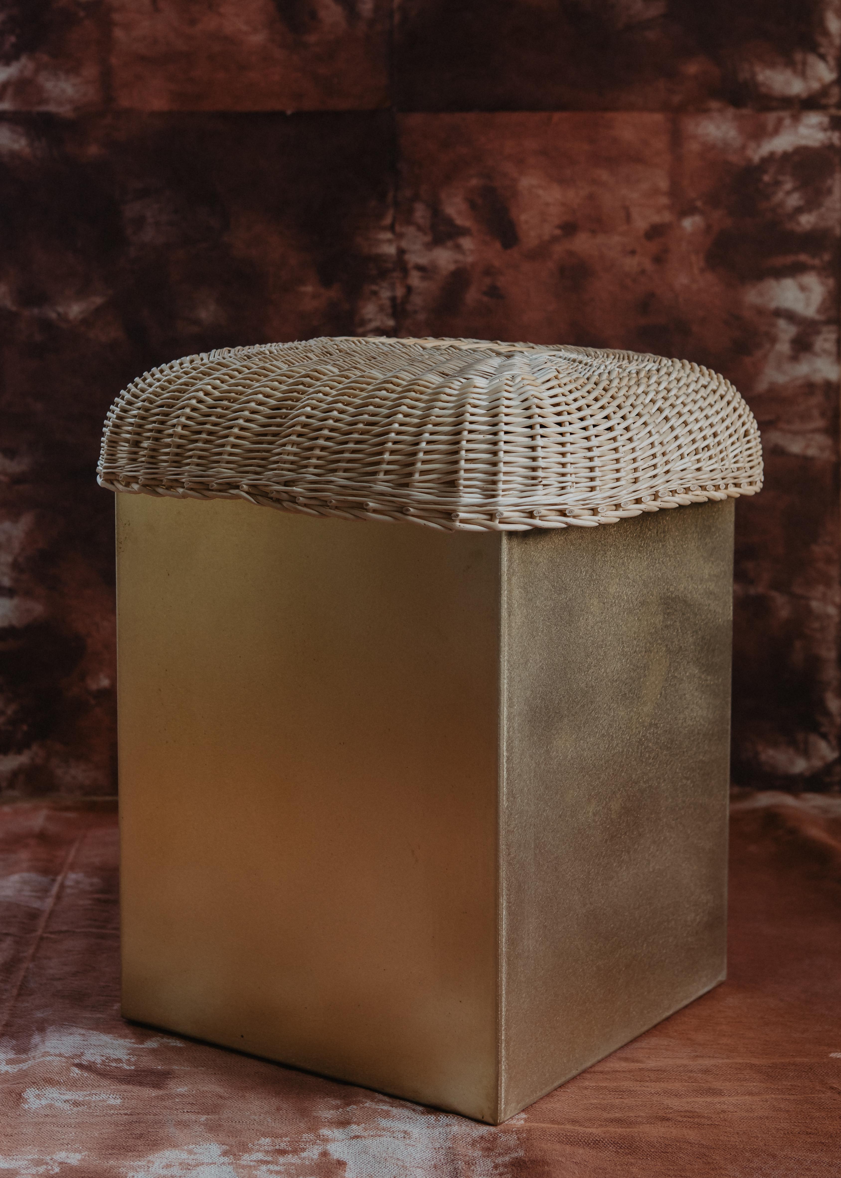 Boudoir Stool by Mylene Niedzialkowski
Dimensions: Ø 35 x H 45. 
Materials: Brass and wicker.

Stool with brass, seat in fine wickerwork, entirely handmade. Hand-woven black wicker from Villaine.

All our collections start from an exploration, from