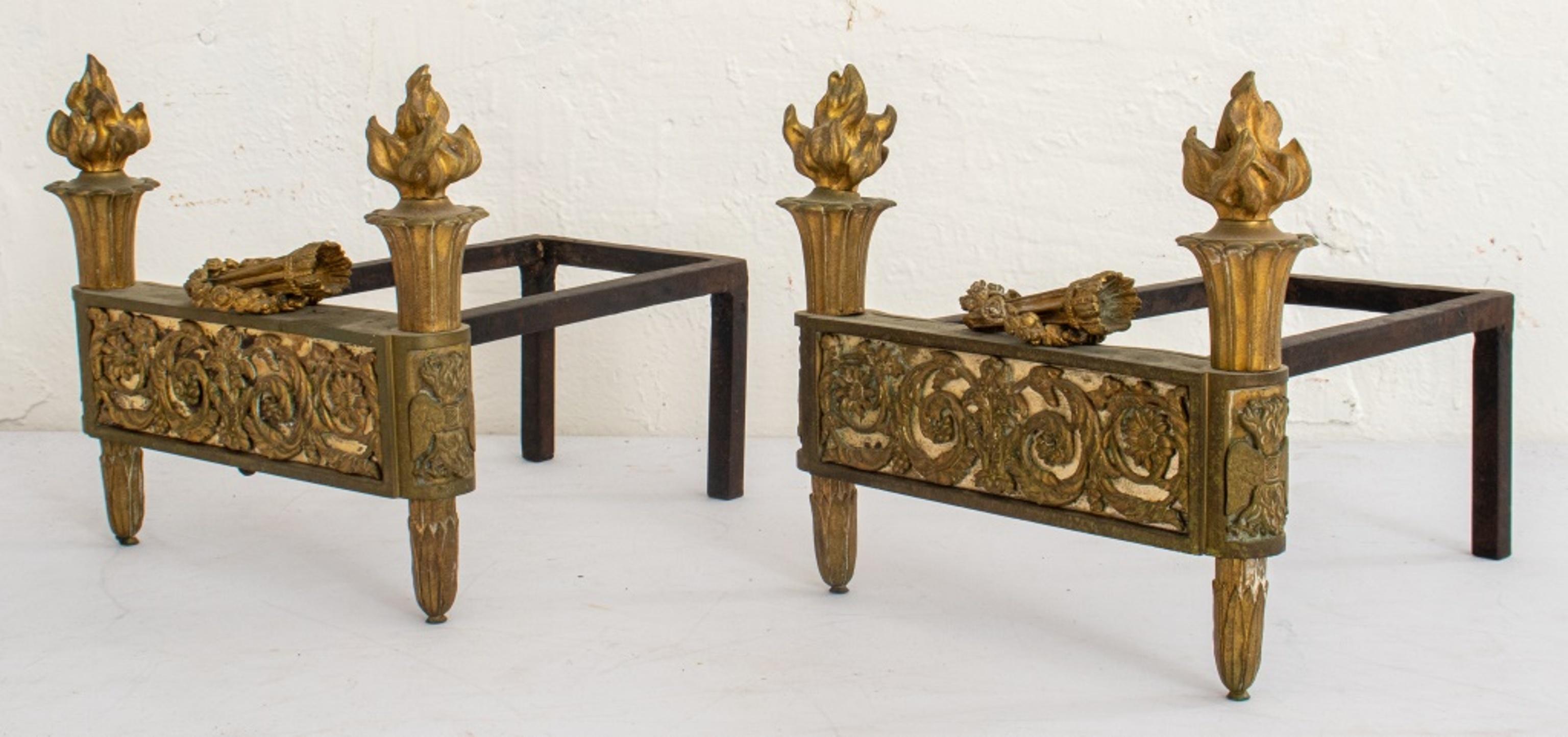 Louis XVI style gilt bronze chenets or fire dogs attributed to Bouhon Freres, with a central frieze of acanthus scrollwork surmounted by wreaths (losses), and supported by two quivers of arrows. In very good vintage condition.

Dealer: S138XX