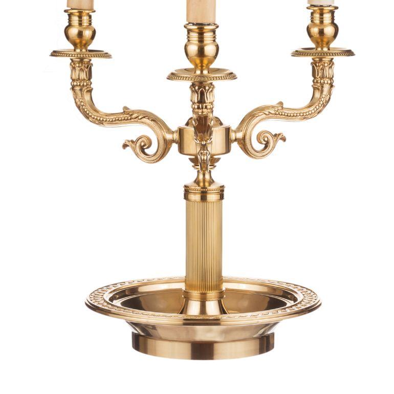 The Bouillotte lamp is named after a popular French card game that emerged in the 18th century and had a following well into the century. A bouillotte is a table lamp that typically consists of two or four candle holders extending from a rounded