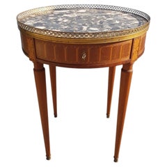Table « bouillotte » de style Louis XVI avec marqueterie