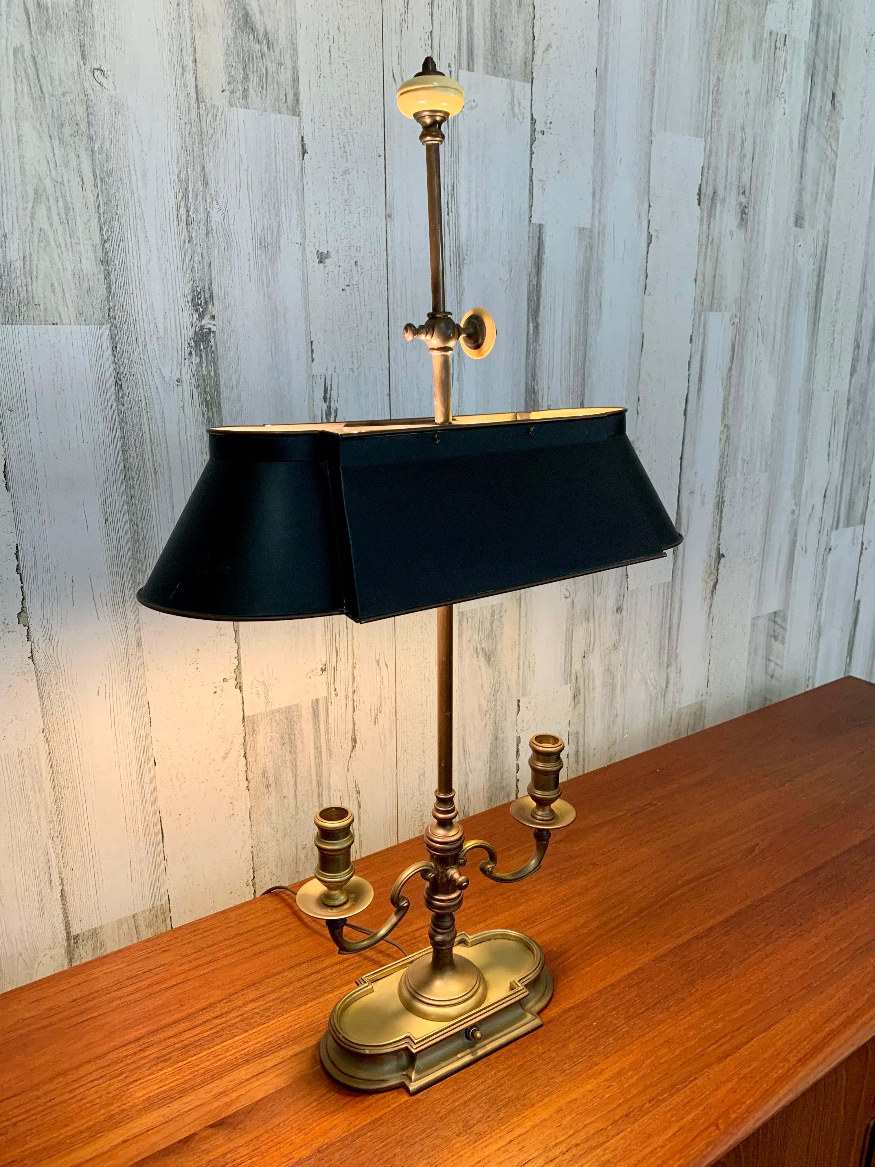 Chapman Bouillotte table lamp with brass and black tole shade and faux marble accents.