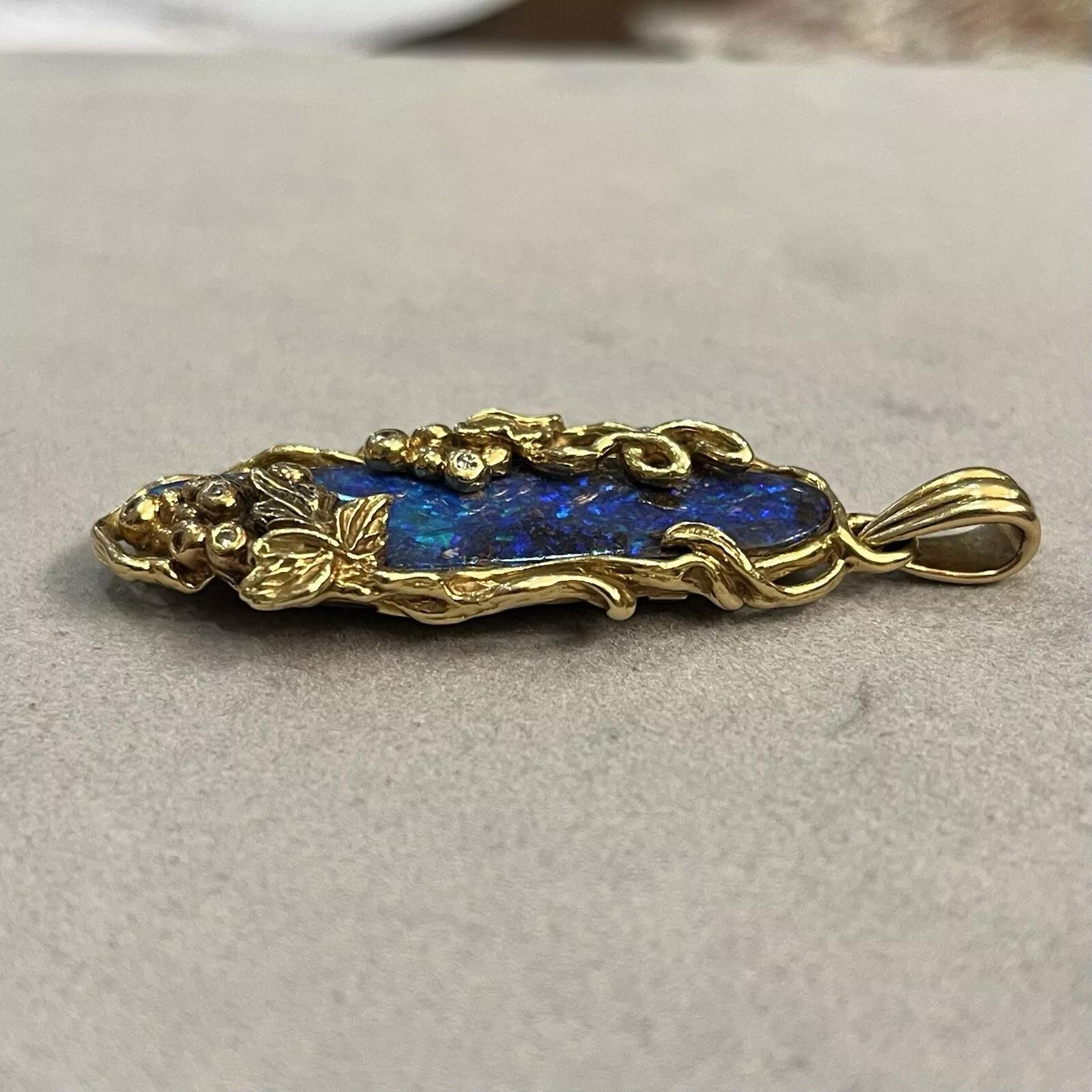 Oval Cut Boulder Opal 19.57 ct and Diamond Pendant in 18k Yellow Gold For Sale