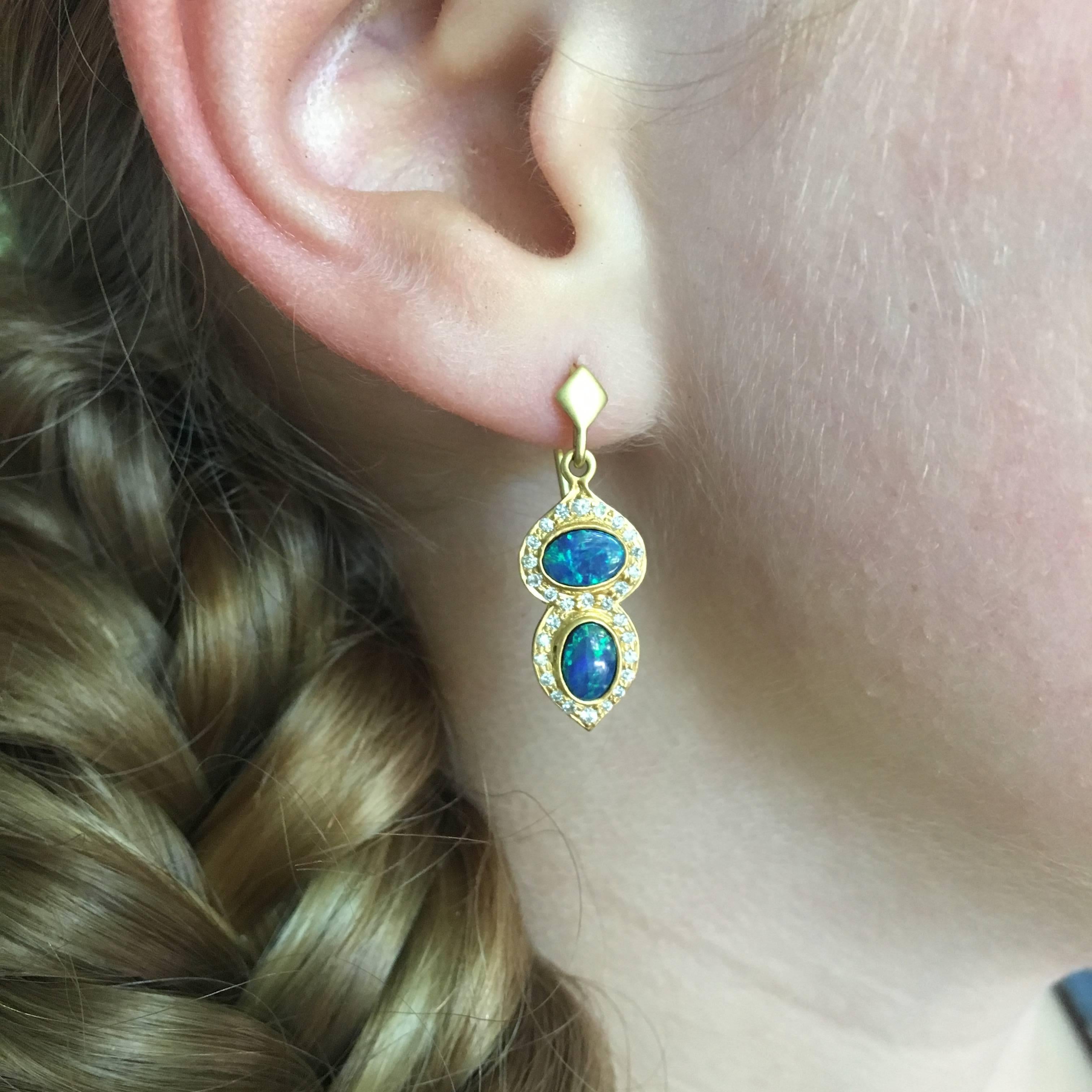 Designed by award winning designer, Lauren Harper, these blue Boulder Opals have flashes of green in them that are truly unique.  Surrounded with solid 18kt Gold in Lauren Harper's signature matte finish, with .32cts of white faceted diamonds, these