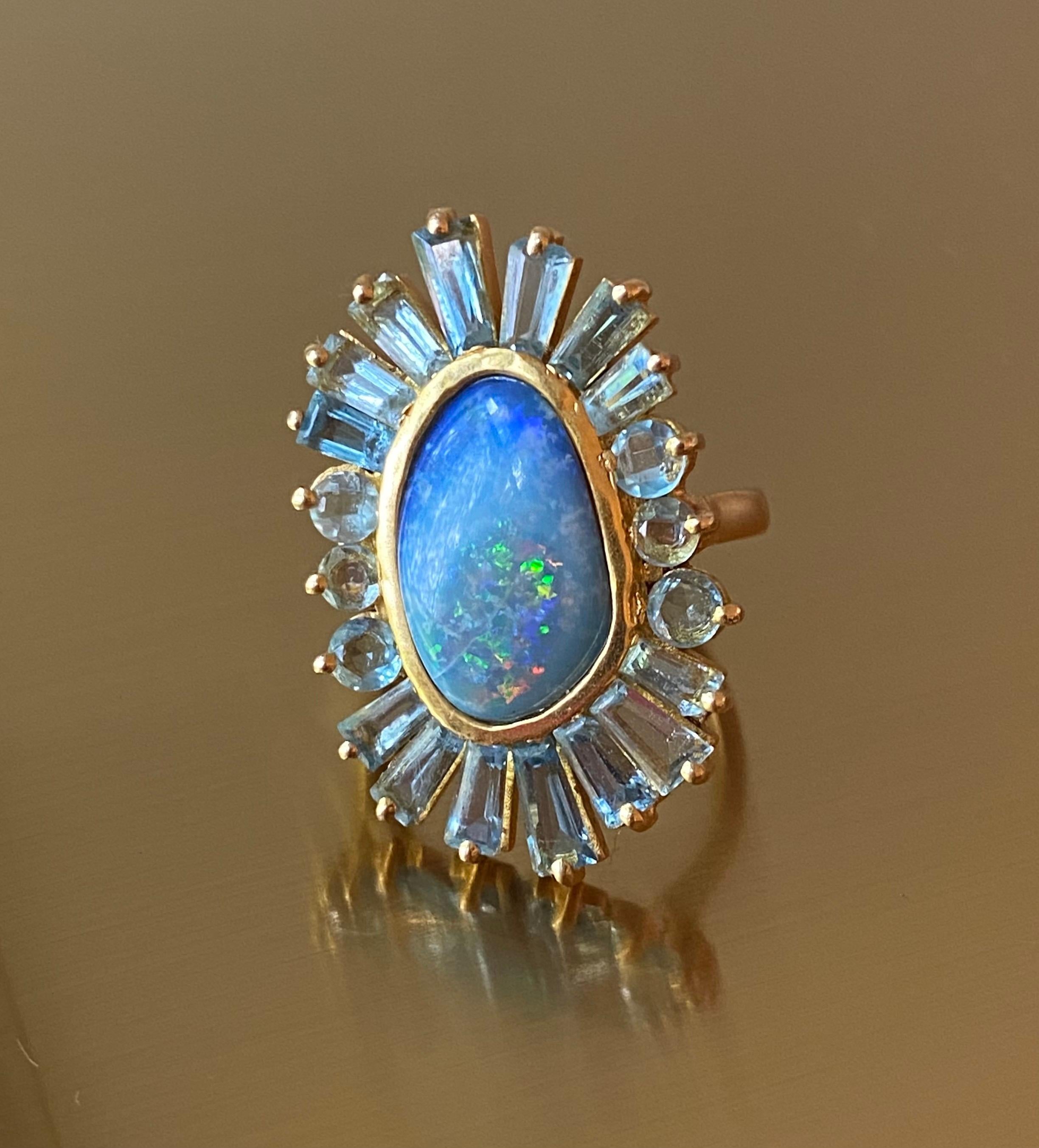 Designed by award winning jewelry designer, Lauren Harper, this Boulder Opal and Aquamarine Cocktail Ring is set in a warm 18kt Yellow Gold and is sure to dazzle. Size 6. Ships in beautiful Lauren Harper Collection Packaging worthy of gift giving.