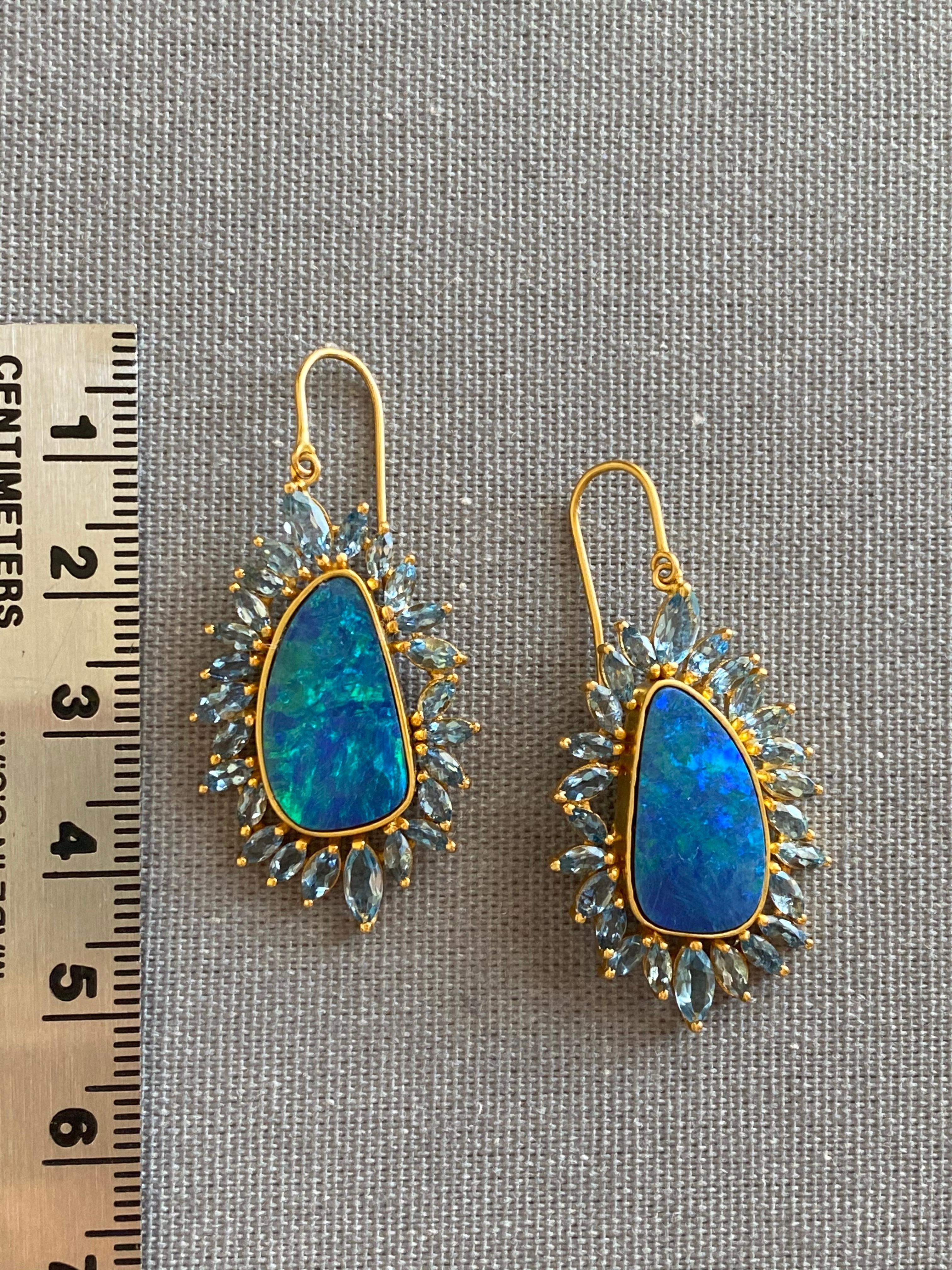 Designed by award winning jewelry designer, Lauren Harper, these Boulder Opal and Aquamarine earrings are simply stunning. The Opals have both blue and green flash and are surrounded by a hand made 18kt Gold crown of marquis shaped faceted