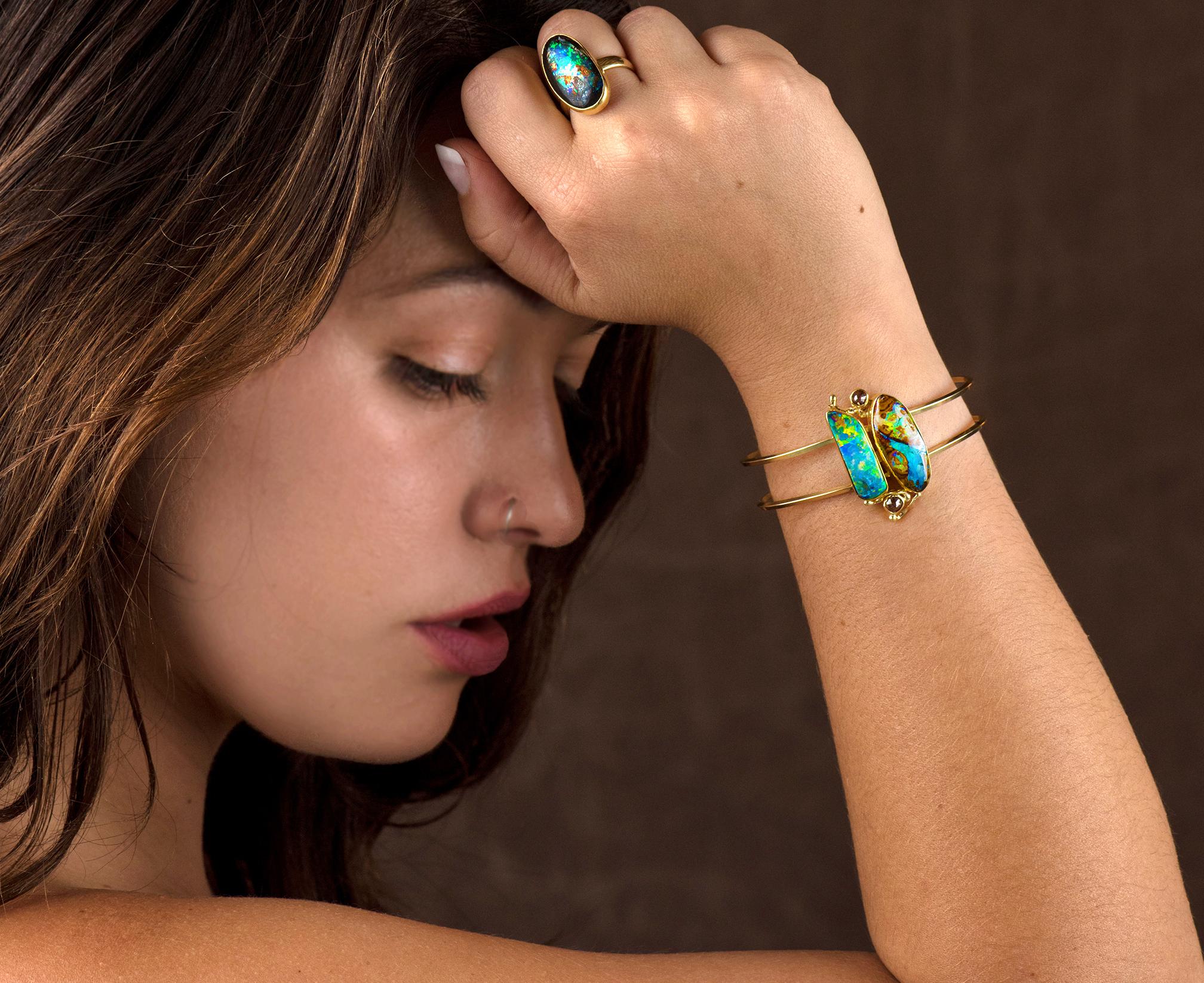 This Boulder opal cuff bracelet is for the person who wants interesting, colorful opal, but a delicate look. The Boulder Opal on the left looks like an abstract painting, the opal on the right is full of every color boulder opal has to offer!   I
