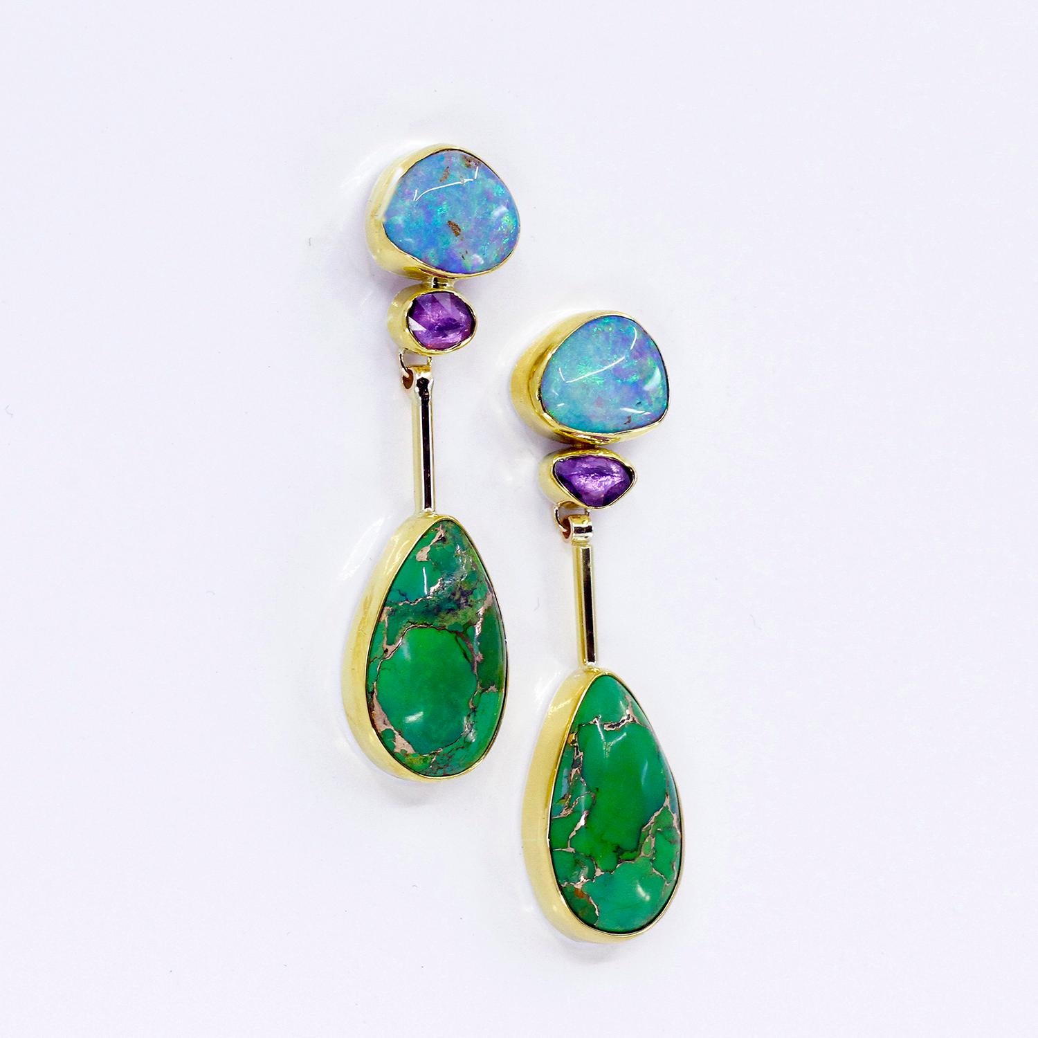 These audacious boulder opals dangle earrings blur the line between raw earth and refined luxury. Swirling with natural opal patterns, sapphire, and turquoise infused with brass set in 22k and 18k gold—a fearless celebration of color and texture.