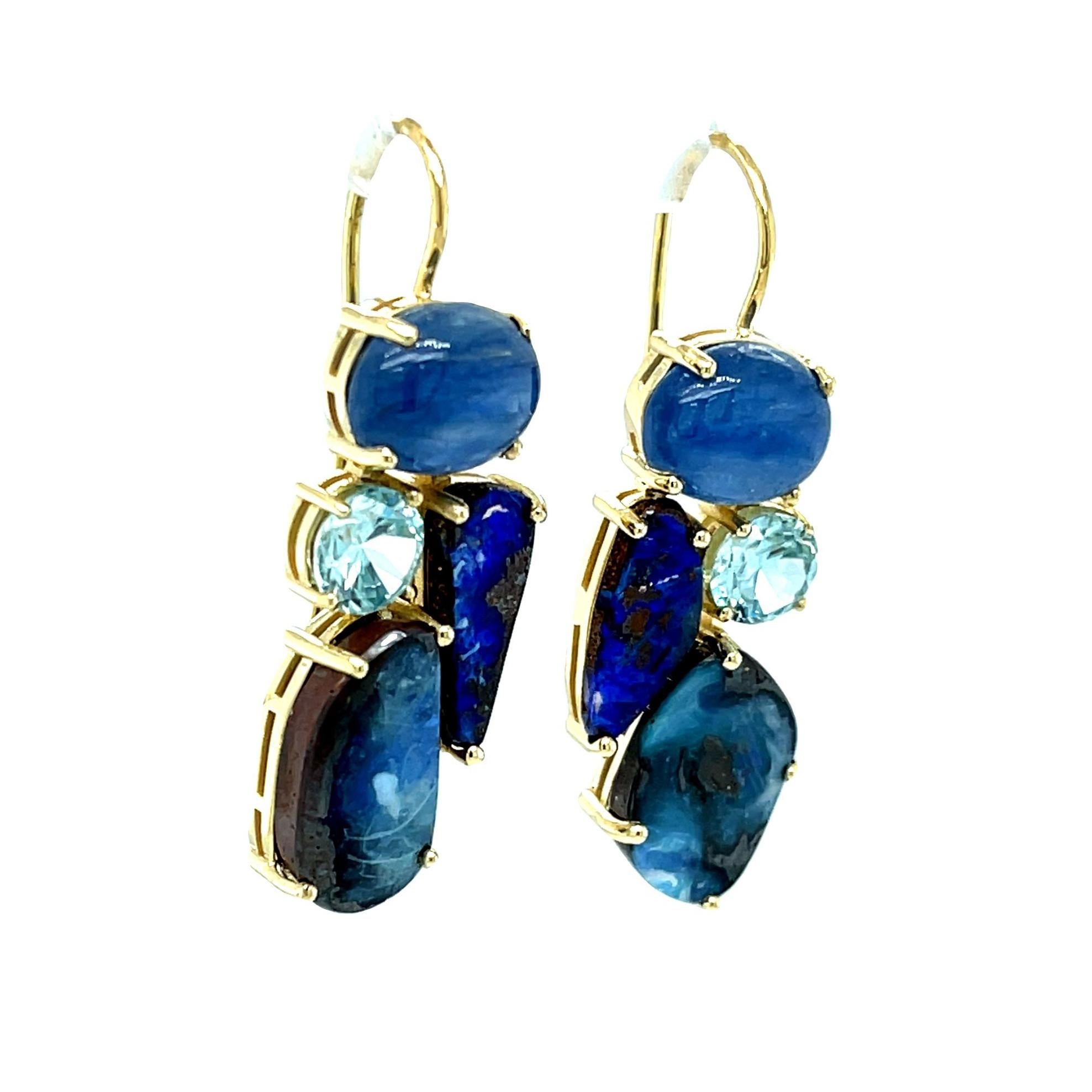 These chic, one-of-a-kind earrings feature a beautiful color combination of blue boulder opals, blue topaz, and kyanite, a lovely mineral often mistaken for blue sapphire. A really fun pair of earrings that can look Bohemian or black-tie elegant,