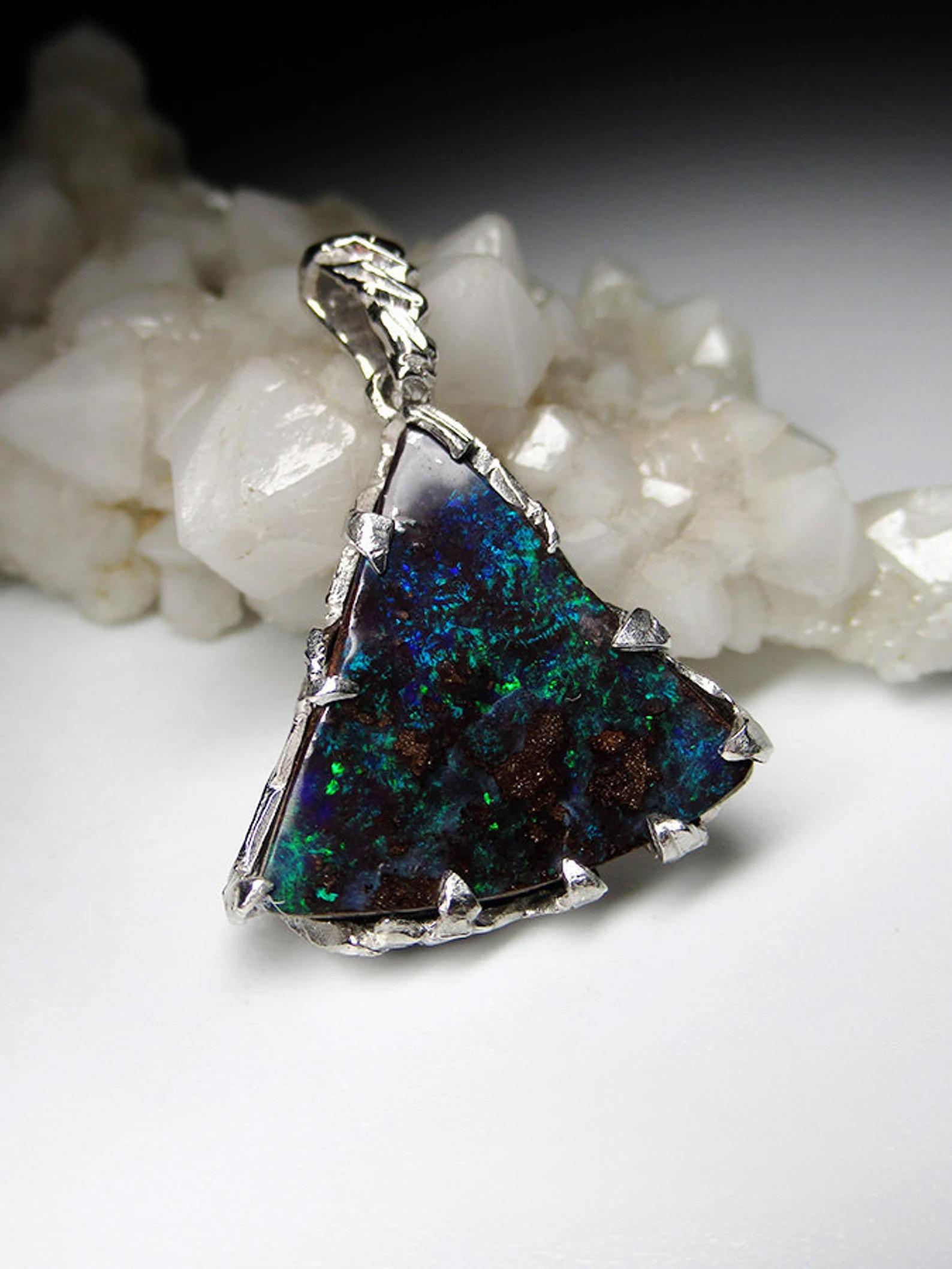 Silver pendant with natural Boulder Opal 
opal origin - Australia
opal measurements - 0.16 x 0.75 x 0.75 in / 4 х 19 х 19 mm
opal weight - 8.90 carat
pendant length - 30 mm / 1.2 in
pendant weight - 3.79 grams


We ship our jewelry worldwide – for