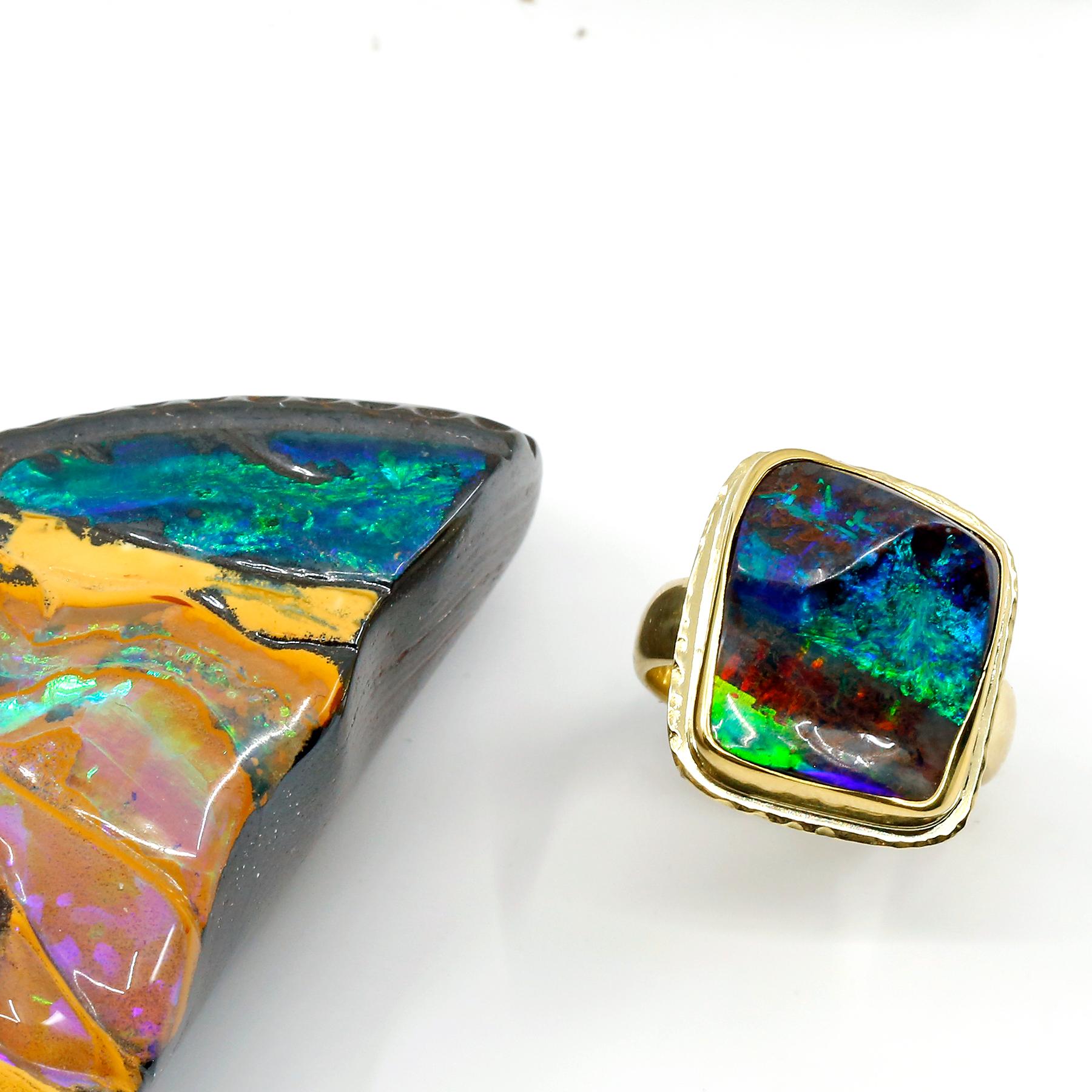 Art jewelry is as unique as its collectors.  This boulder opal not only has the blue, green & red flashes that everyone loves, but it has a unique quality of a pyramid stone.  Meaning, that instead of a flat surface it undulates much like a pyramid.