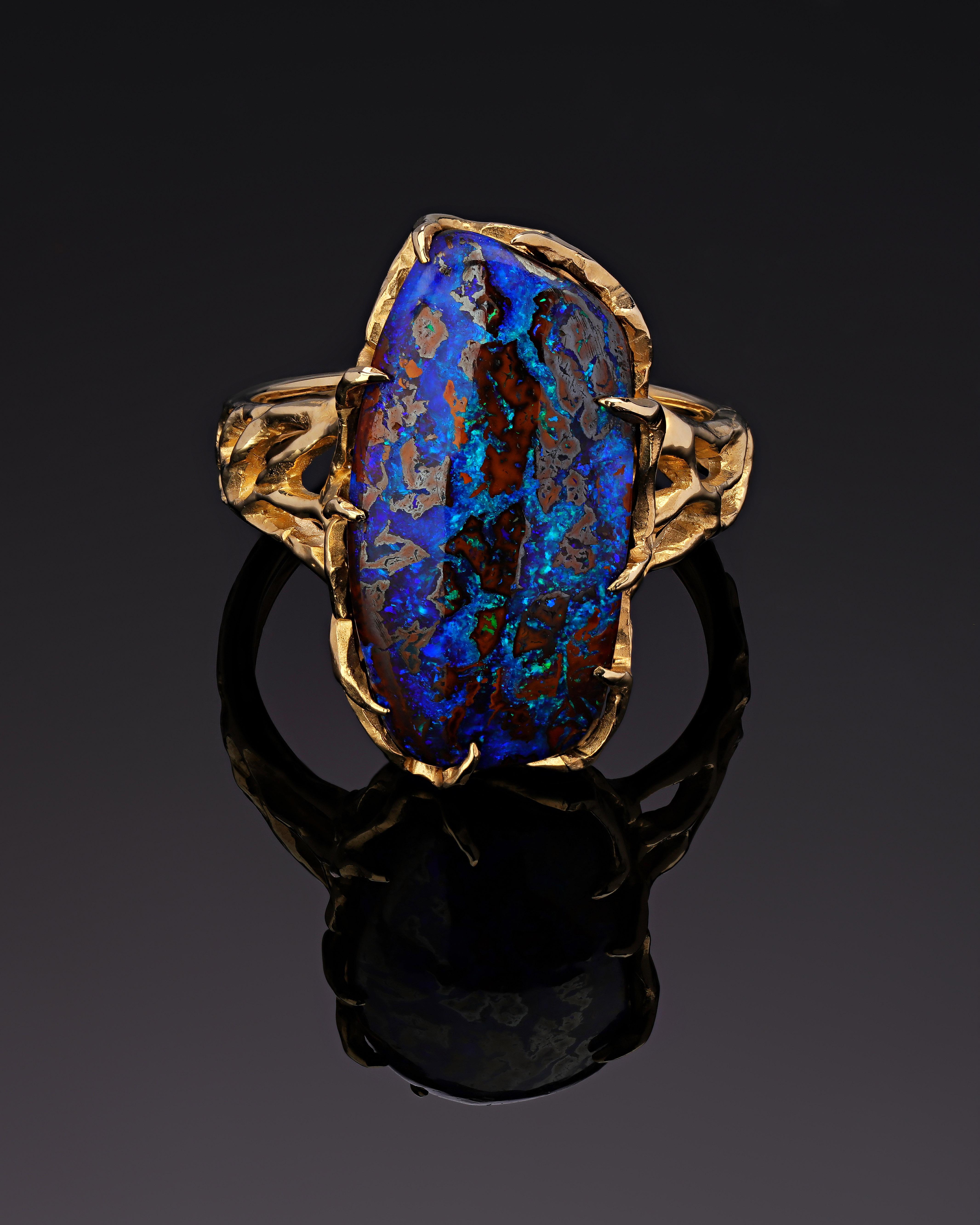 14K yellow gold ring with unique Boulder Opal 
Opal origin - Australia
Opal measurements - 0,24 х 0.0,43 х 0,79 in / 6 х 11 х 20 mm
stone weight - 12.70 carats
ring weight - 6.89 grams
ring size - 7.5 US


We ship our jewelry worldwide – for our