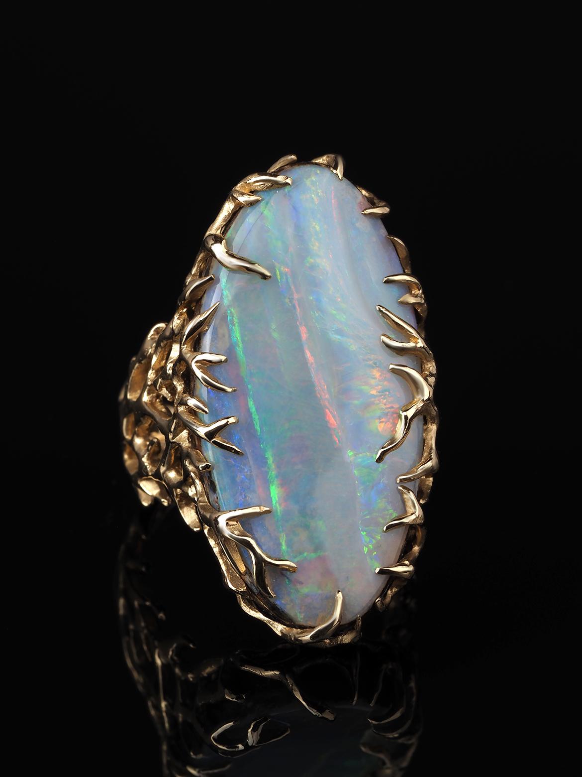 Natural boulder Opal 14k yellow gold ring 
Opal origin - Australia
Opal measurements - 0.16 х 0.59 х 1.18 in / 4 х 15 х 30 mm
gemstone weight - 16.50 carats
ring weight - 10.44 grams
ring size - 6.5 US