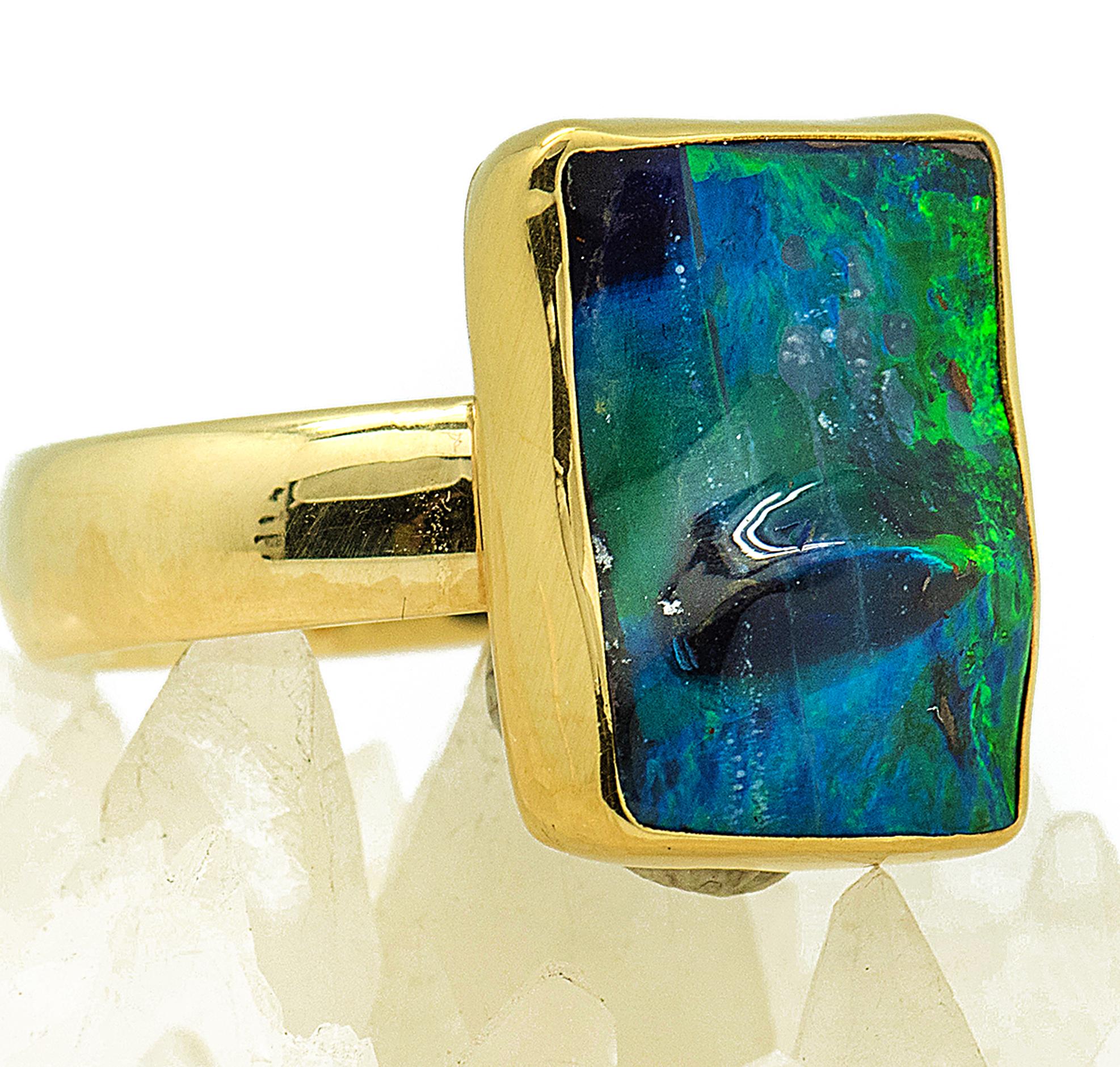 Boulder opal ring with the most intense green & blue fire, one cannot stop looking at, it even has a 