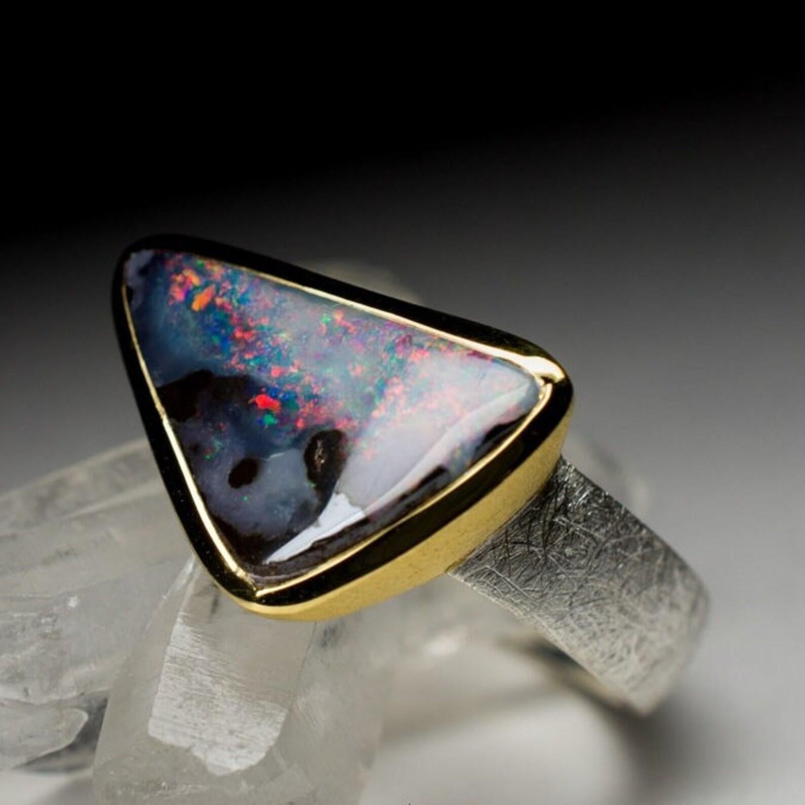 Vintage 18K yellow gold plated and matte finish silver ring with natural Australian Boulder Opal
opal origin - Lightning Ridge, Australia 
boulder opal measures  - 0.16 x 0.35 x 0.63 in / 4 х 9 х 16 mm
weight of the ring - 5.59 grams
ring size - 8.5