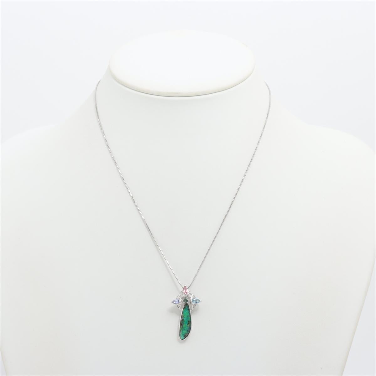 Stunning Australian Boulder Opal Abstract Cabochon

Dangle pendant with accent diamonds and Sapphires

Stunning for any occasion.

18k 750 White Gold pendant, Chain Necklace is 18k White Gold .

Details:
17mm by 31mm Pendant -- 
3ct Genuine