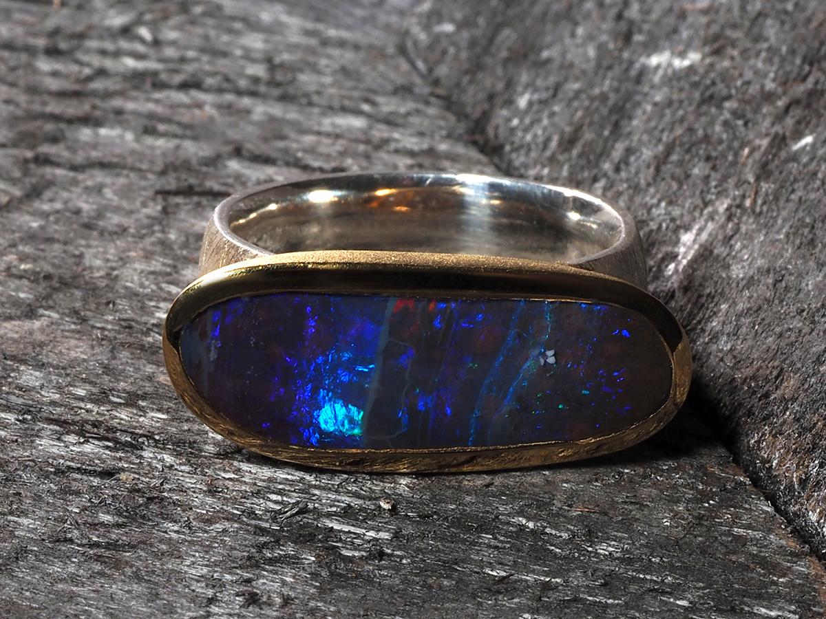 silver ring with dark blue stone