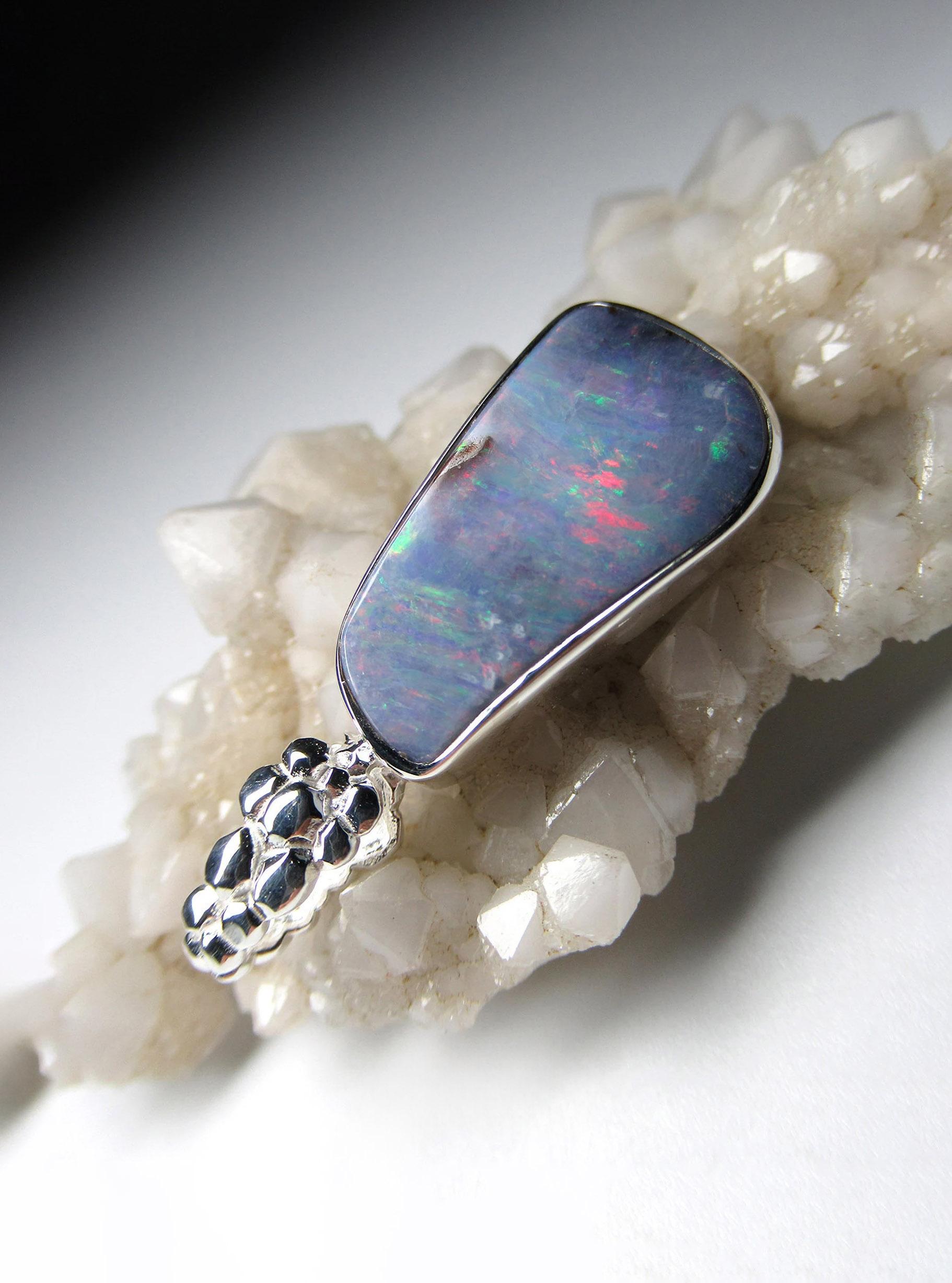 Silver pendant with natural Boulder Opal
gemstone origin - Australia
opal measurements - 0.16 x 0.43 x 0.83 in / 4 x 11 x 21 mm
opal weight - 19.45 carats
pendant length - 1.3 in / 33 mm
pendant  weight - 4.85 grams