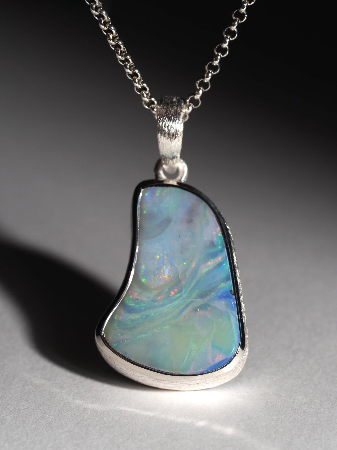 Silver necklace with natural Boulder Opal with gentle Blue, Green, Orange opalescence
gemstone origin - Australia, weight of Opal - 12.20 carat
gem size is 16 x 23 mm
pendant length - 33 mm
pendant weight - 5.15 grams
The necklace comes with a
