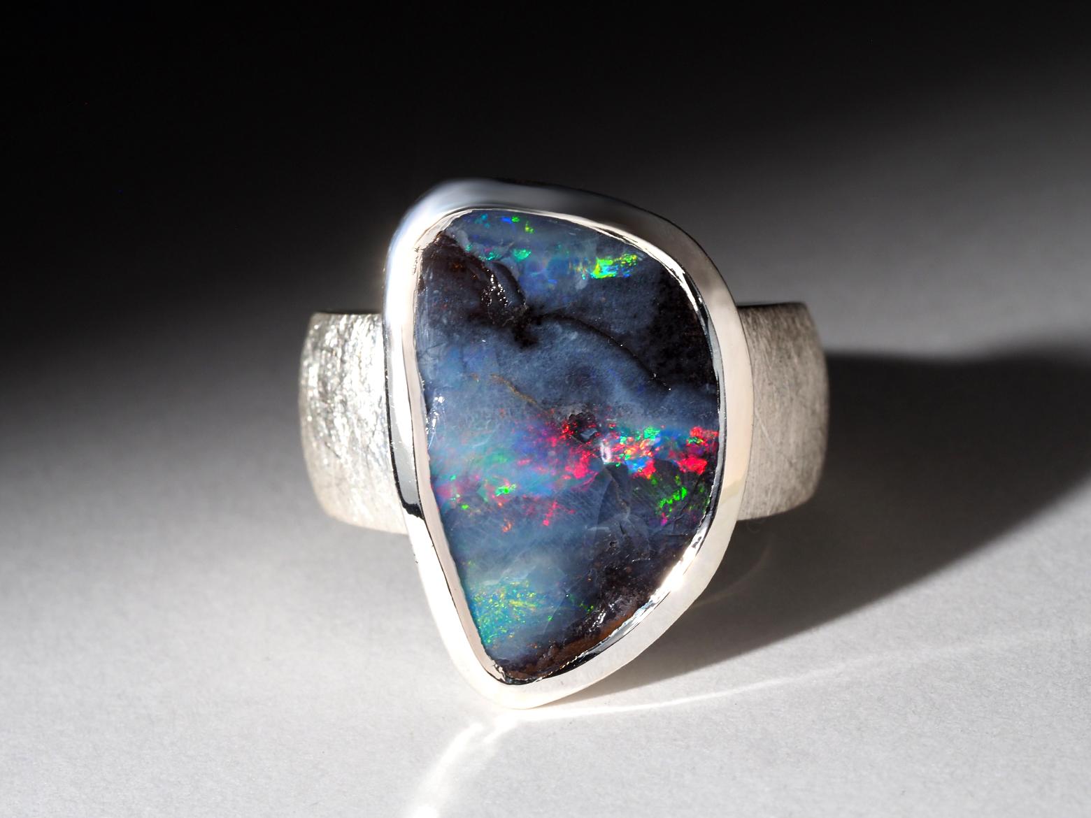 Silver ring with natural Boulder Opal 
Opal gemstone origin - Australia 
opal measurements  - 0.47 x 0.85 in / 12 x 19 mm
ring weight - 12.5 grams
ring size - 8 3/4 US, diameter 18.75 mm, N 19, 59 circumference
Opal of 12.7 ct


