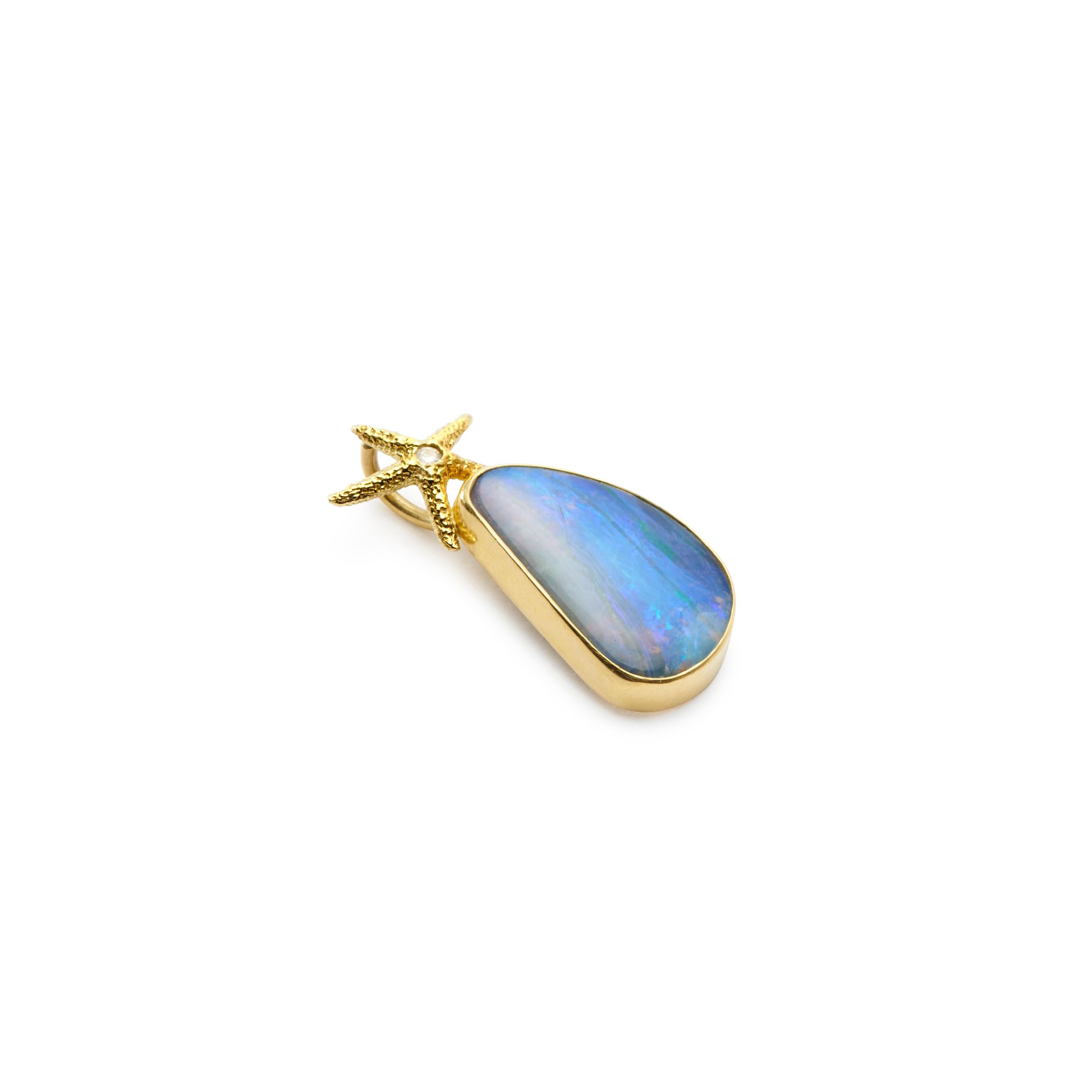 Gorgeous shades of blue in this lovely little Boulder Opal Pendant suspended from a sparkling starfish bale set with a diamond. Wear it alone or layer it, wear it with a white t-shirt or your favorite summer dress.
  
