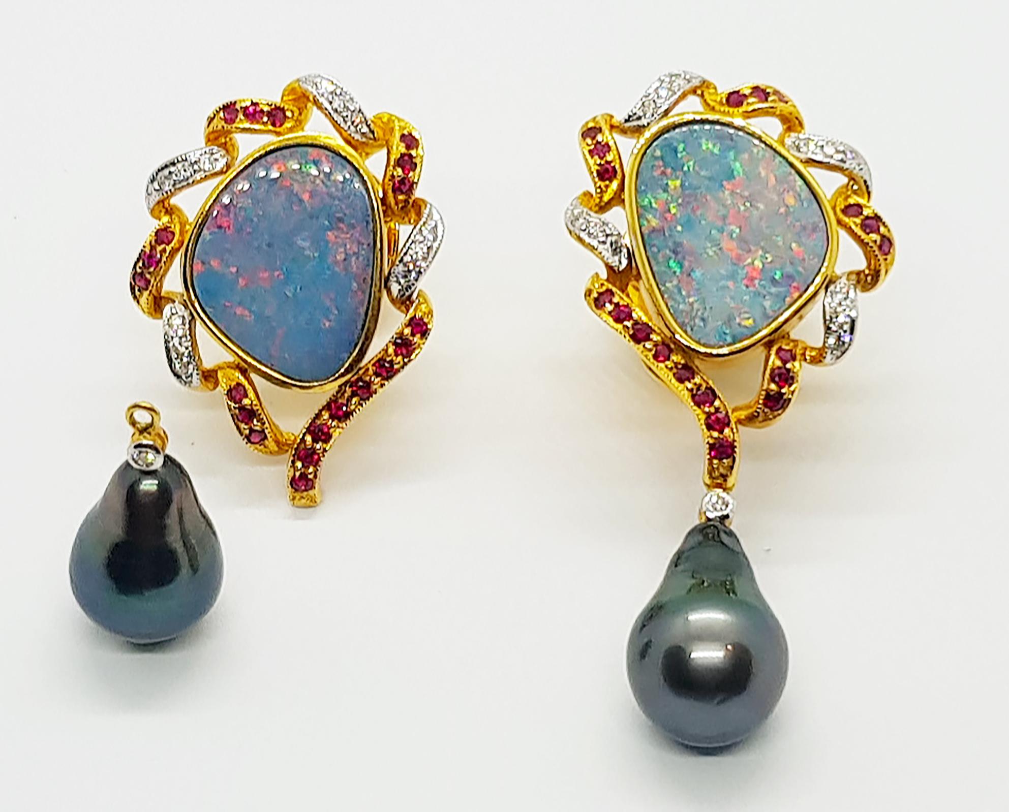 Boulder Opal 11.30 carats with Ruby 0.63 carat, Diamond 0.27 carat and South Sea Pearl Earrings set in 18 Karat Gold Settings

Width:  2.0 cm 
Length: 4.5 cm
Total Weight: 19.74 grams

