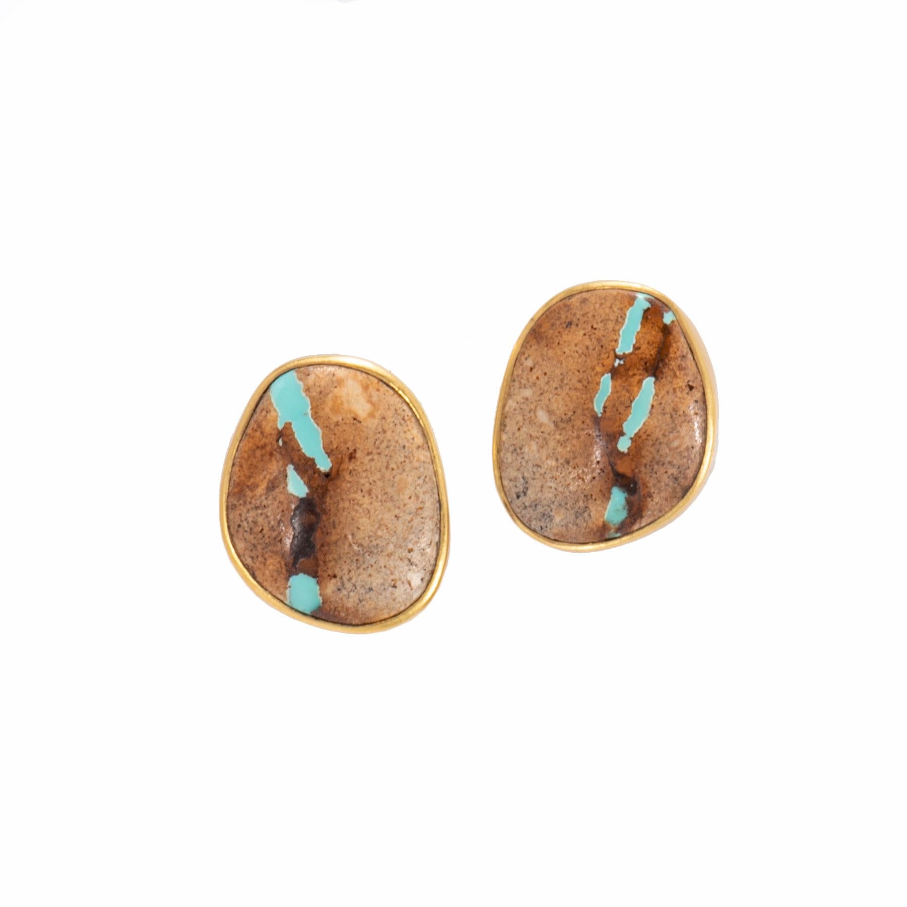 Boulder Turquoise Stud Earrings are bezel set in 22 karat gold with our signature satin finish to enhance the rich browns of the cabs and highlight blue veins of turquoise. Boulder Turquoise refers to the cut of the stone, whereby the stone cutter