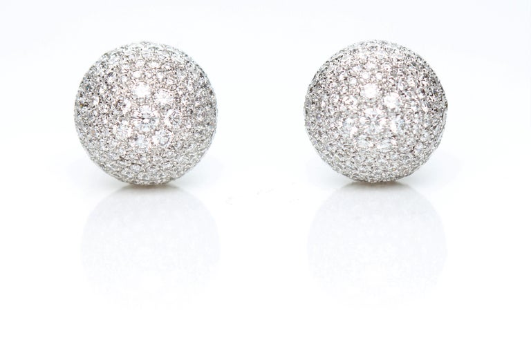 Boule Earrings with Pavè of 13.00 Carats of Diamonds in 18 Kt White Gold.
The earrings are formed by a semicircle of six graded diamonds, to which a boule with a pave setting of 13.00 carats of diamonds is attached. 
The closure of the earrings has