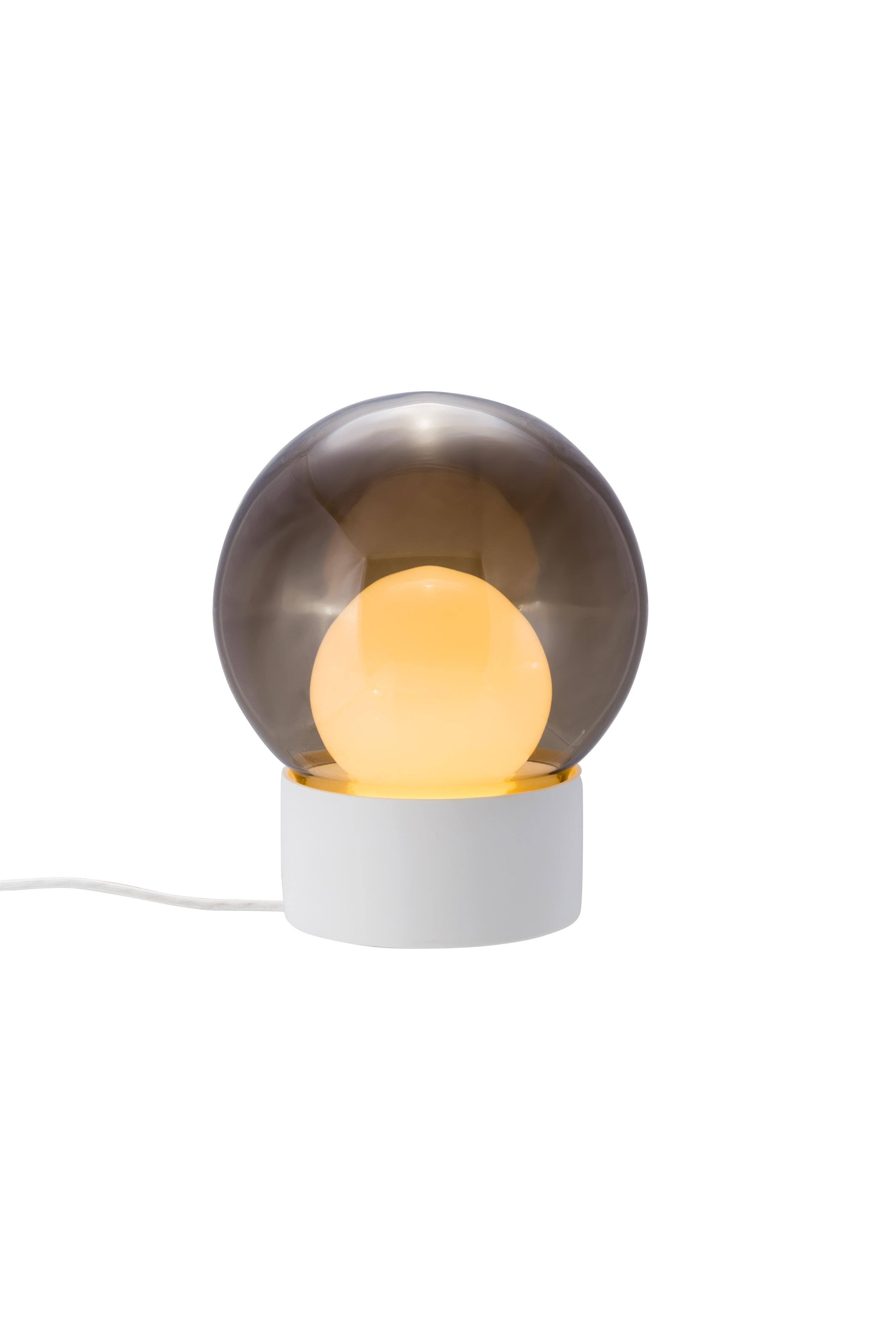 Boule small smoky grey opal white table lamp by Pulpo
Dimensions: D 29 x H 35.5 cm
Materials: ceramic, handblown glass, coloured, textile.

Also available in different finishes: transparent opal white black, transparent smoky grey black, smoky