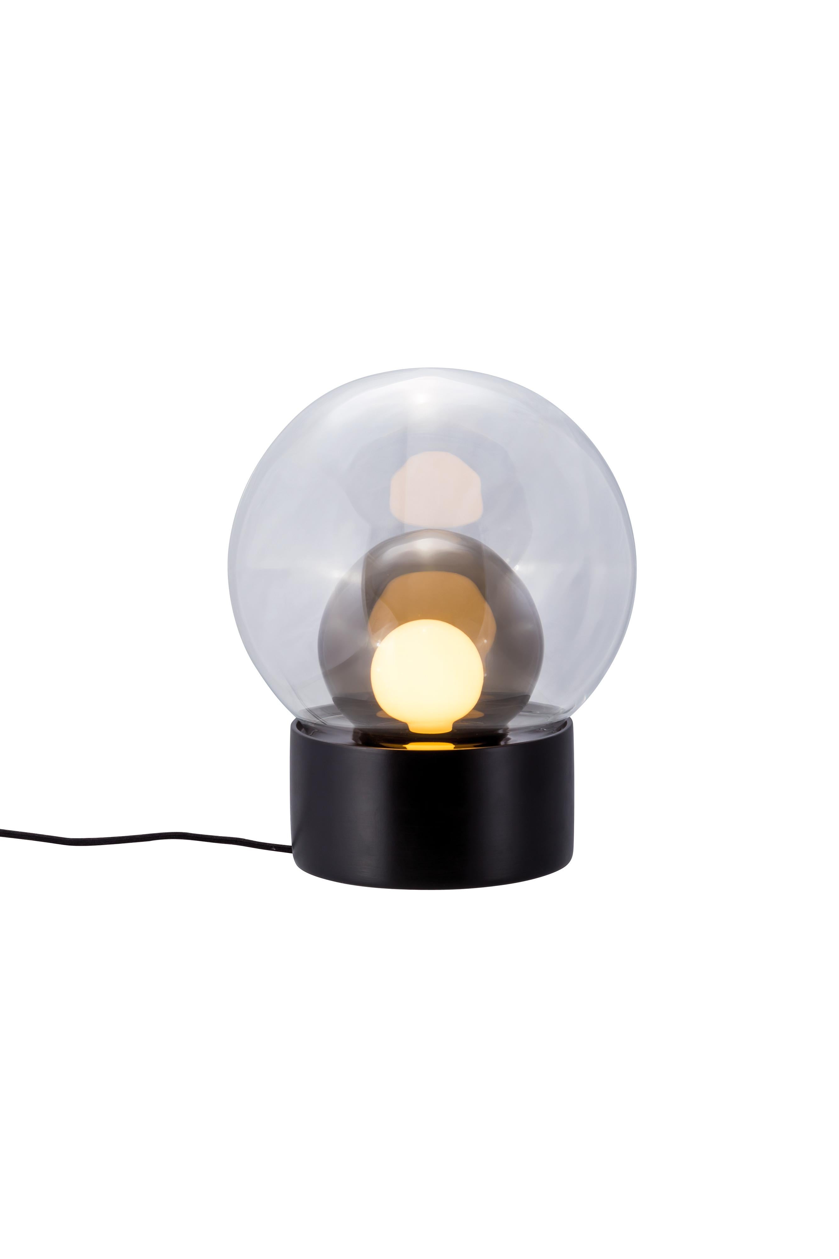 Boule Small Transparent Smoky Grey Black Table Lamp by Pulpo
Dimensions: D29 x H35.5 cm
Materials: ceramic, handblown glass, coloured, textile.

Also available in different finishes: transparent  opal white black,  transparent  smoky grey black,