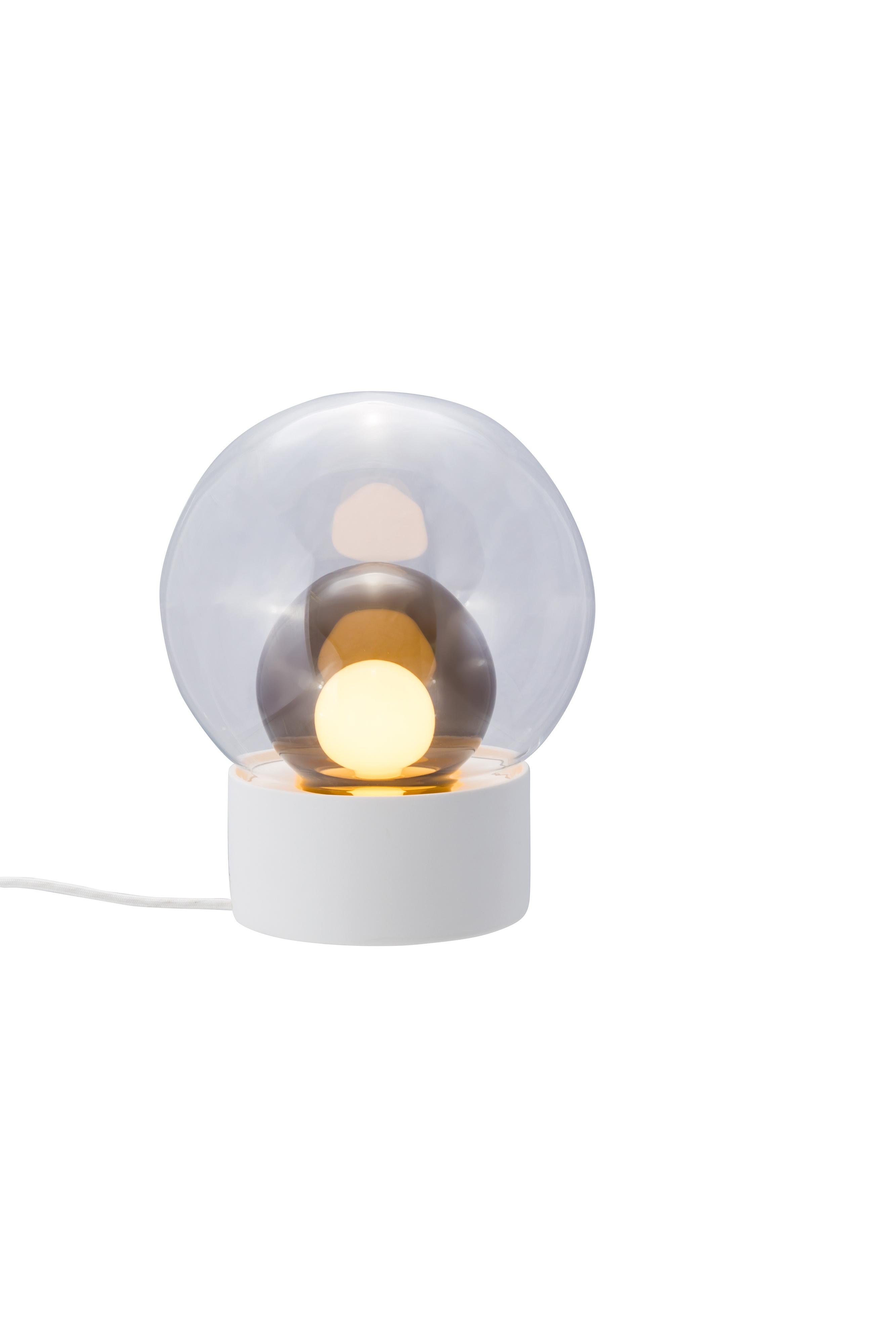 Boule Small Transparent Smoky Grey White Table Lamp by Pulpo
Dimensions: D29 x H35.5 cm
Materials: ceramic, handblown glass, coloured, textile.

Also available in different finishes: transparent  opal white black,  transparent  smoky grey black,
