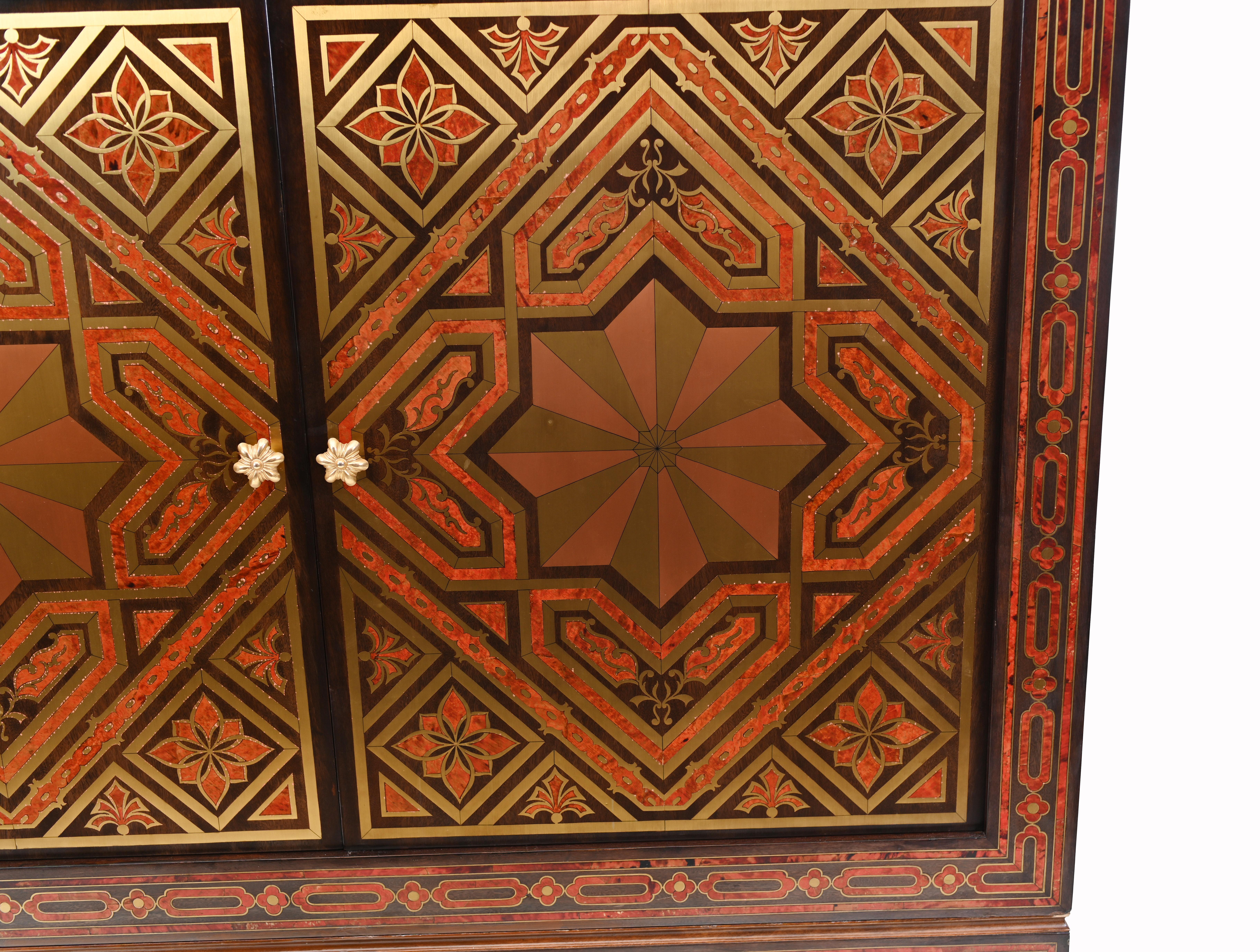 Gorgeous large cabinet or closet decorated with intricate inlay work using exotic woods
Has an Islamic look to both the inlay and the designs of the furniture
The inlay work - which reminds us of Boulle - is incredible
Red lacquer and gilt inlay