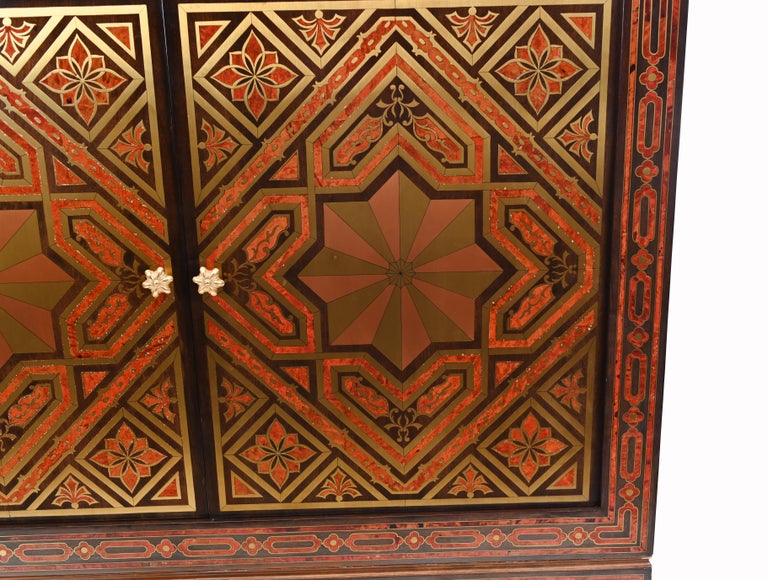 Gorgeous large cabinet or closet decorated with intricate inlay work using exotic woods
Has an Islamic look to both the inlay and the designs of the furniture
The inlay work - which reminds us of Boulle - is incredible
Red lacquer and gilt inlay
