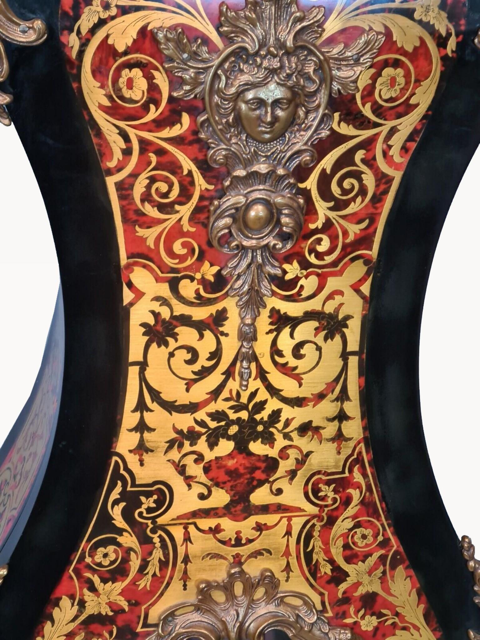 Wonderful Boulle style longcase grandfather clock
Fully working with Westminster chimes
Intricate faux tortoiseshell and brass inlay in the classic Boulle manner
Glass viewing panel set in door
All gilt fixtures are original
We bought this from a