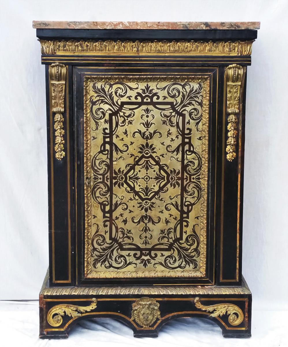 Gorgeous cabinet on restoration at the moment, ebony veneer with rich Boulle style inlay in pewter on the front and the sides. Thick ornamentations in brass, gilt bronze, acanthus leaves and original marble top. The interior is in blackened wood