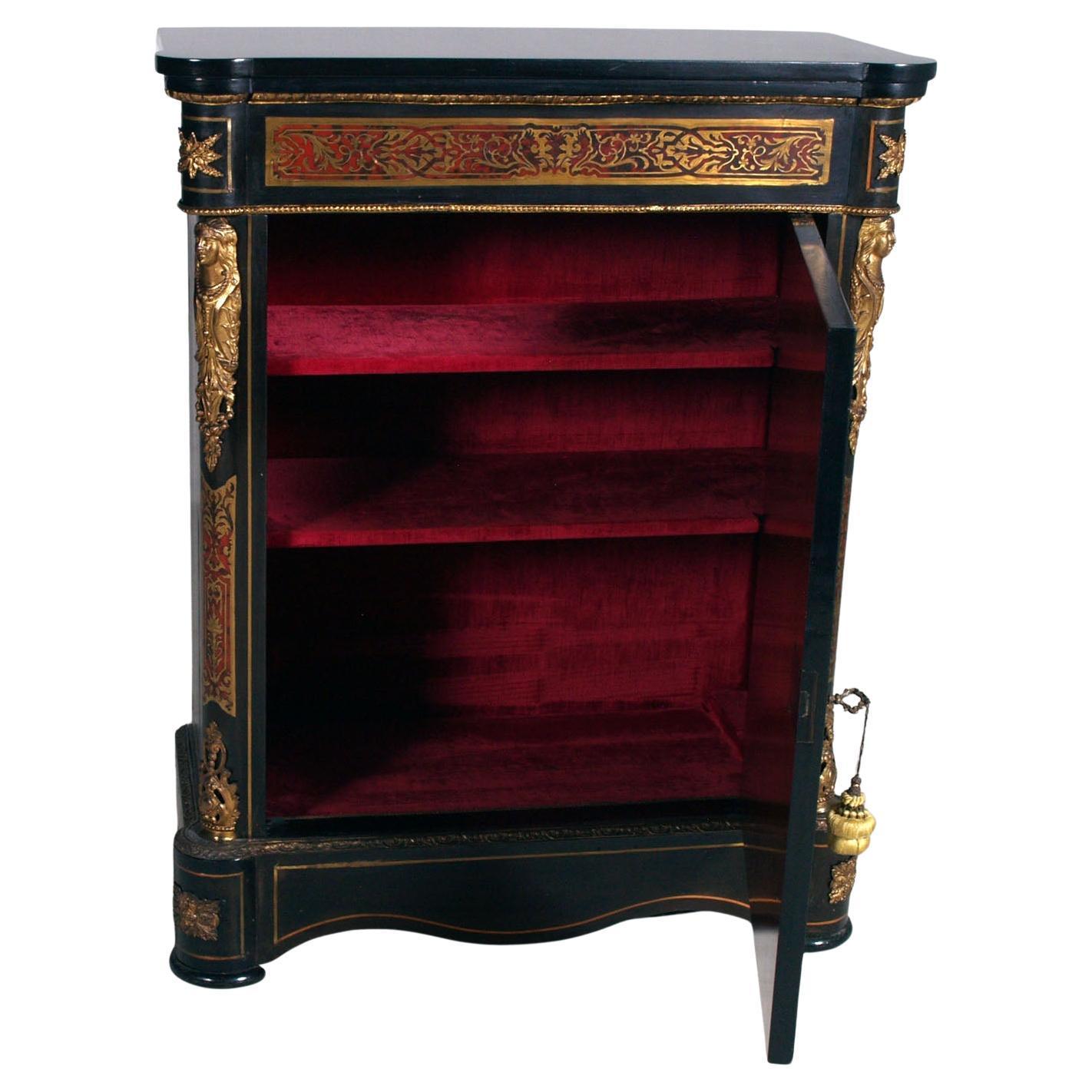 Exquisite Boulle-style cabinet from the second half of the 19th century, crafted with remarkable skill and inspired by the splendor of Louis XIV’s French cabinetry. The structure is made of ebonized wood, lavishly adorned with intricate brass inlays