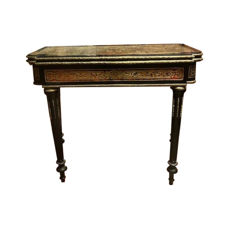 Boulle style game table in ebonized wood and gilded decorations, France For Sale
