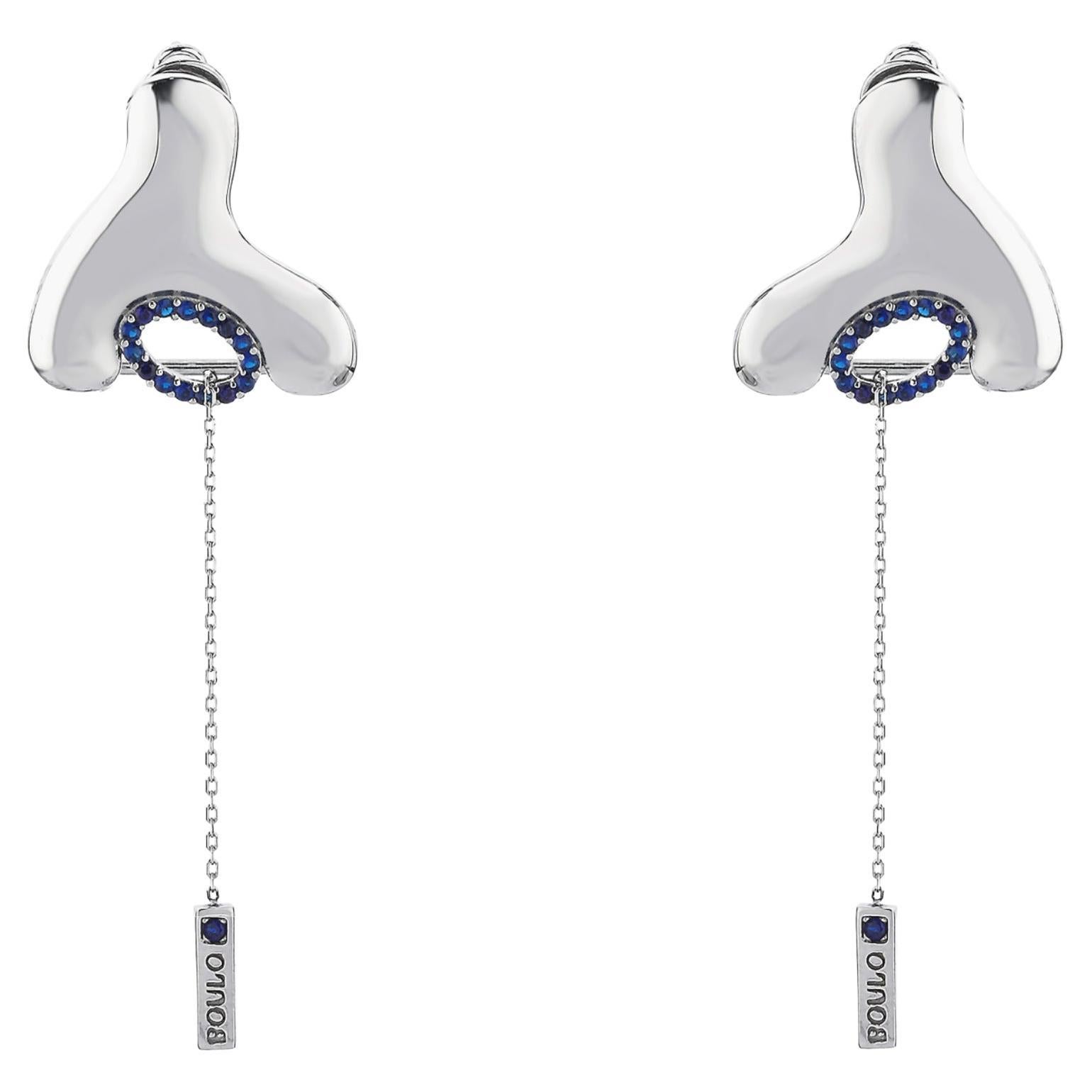 Boulo Einzigartiger Wishbone-Ohrring aus Silber mit marineblauen Steinen und Kettentropfen 